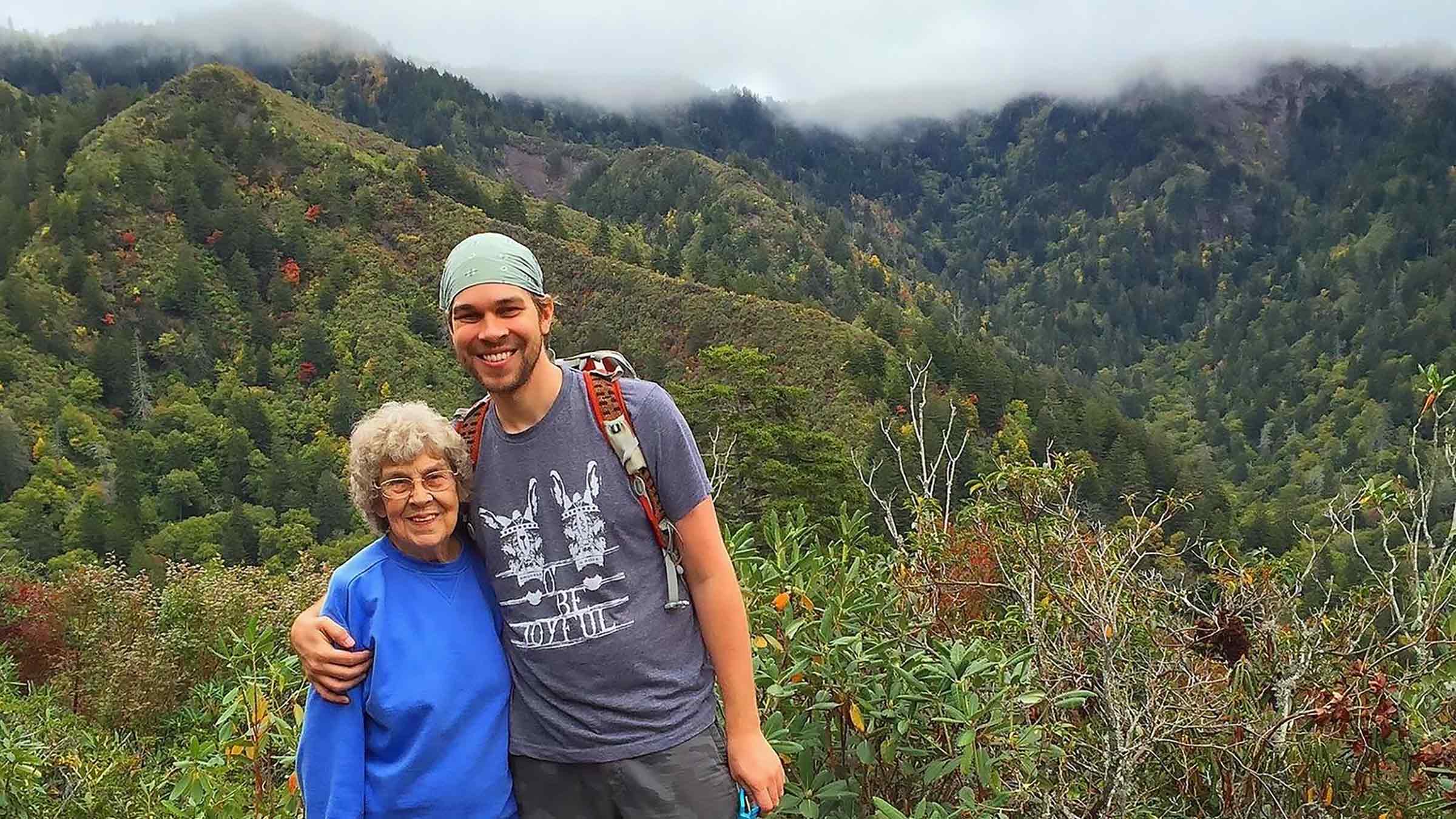 Brad Ryan and his grandmother with the forrest in the background
