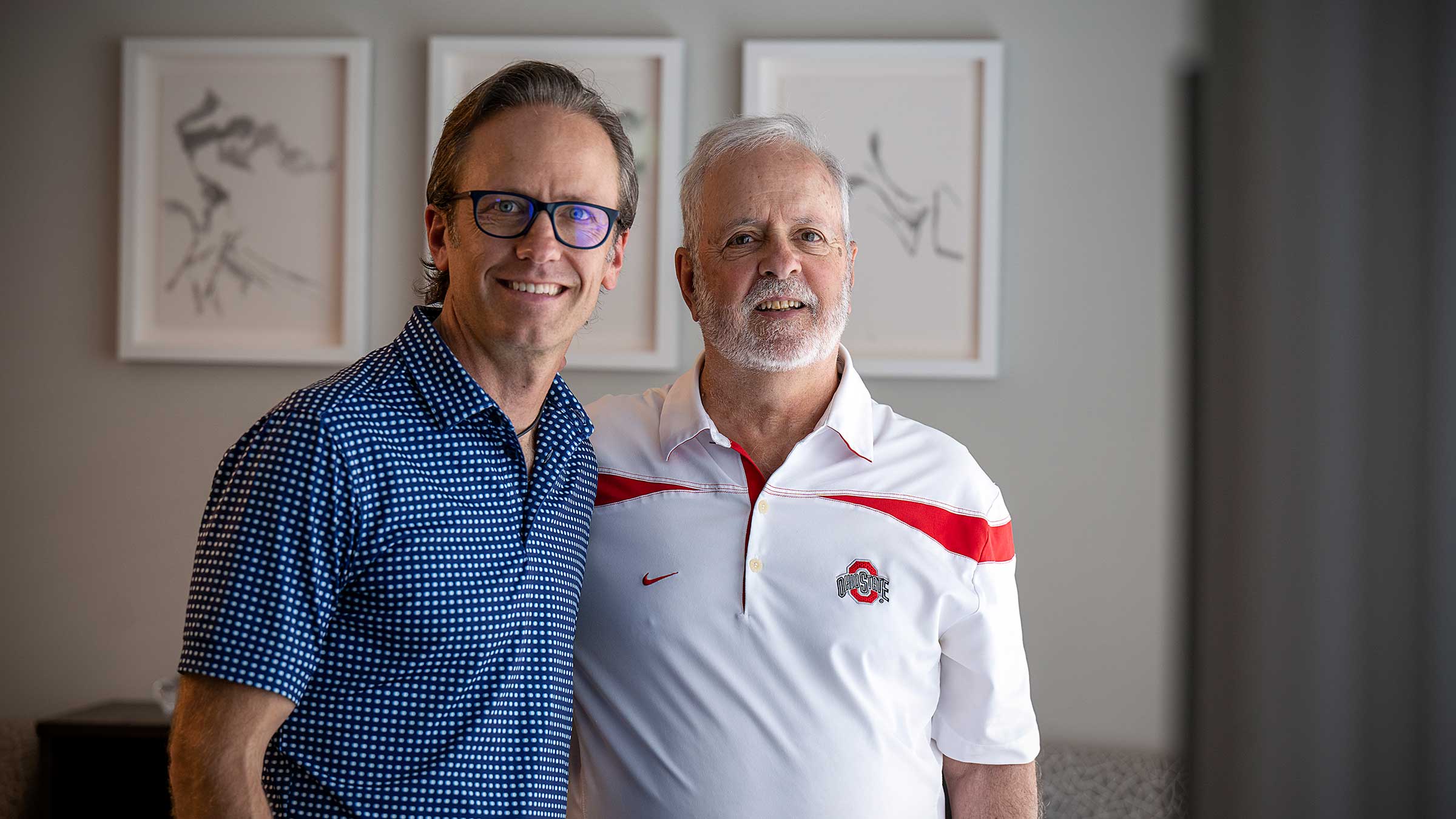 Michael Myser with his father in the living room by the window