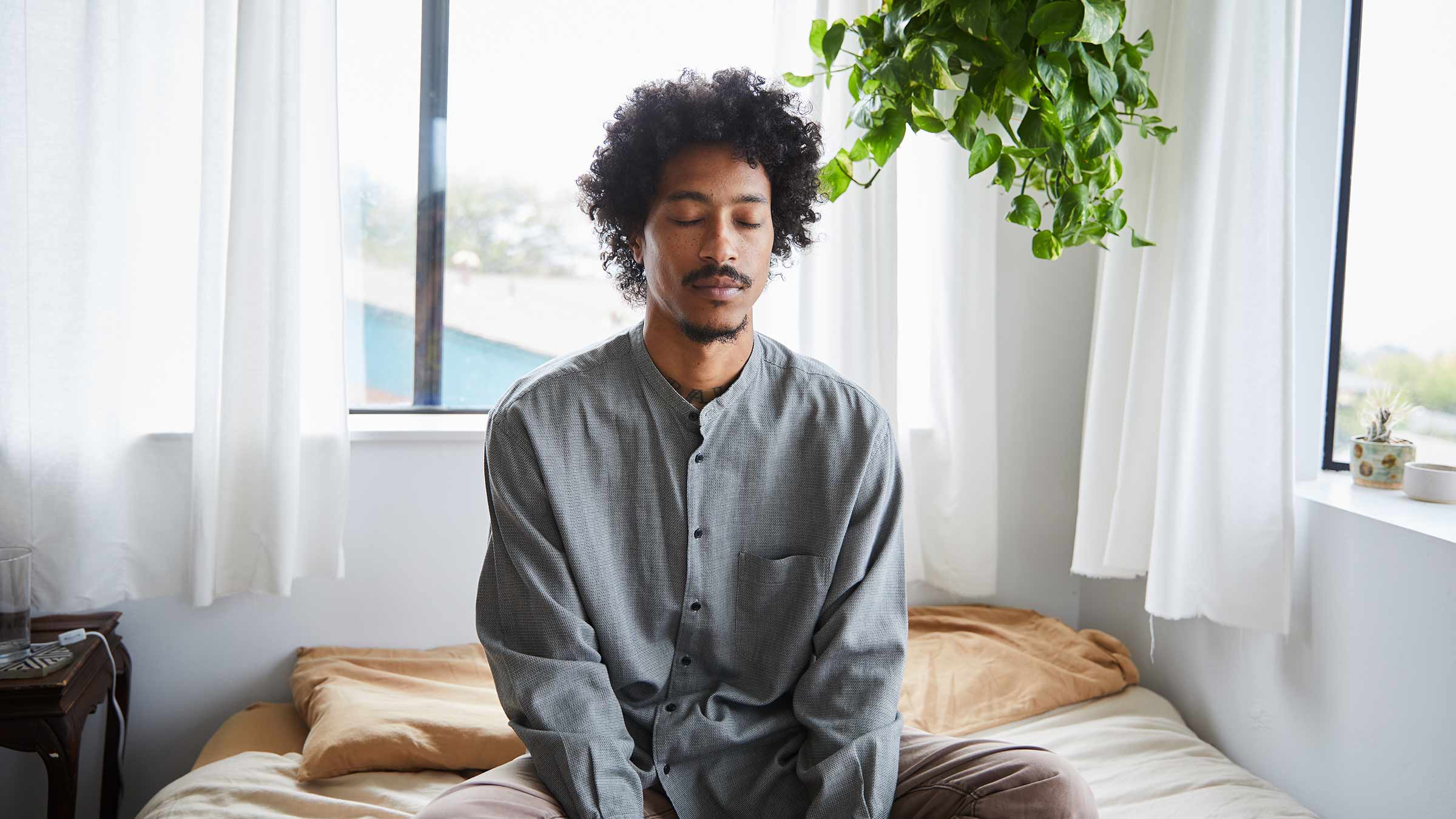 A young man practicing spontaneous meditation