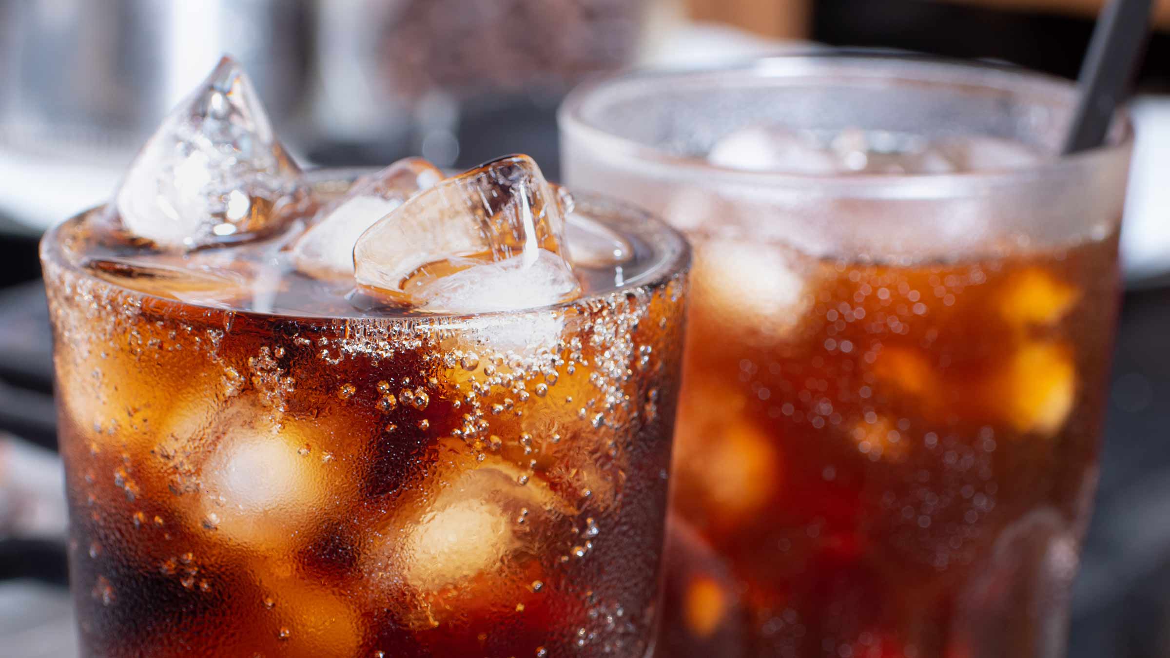 Two glasses with soda and ice