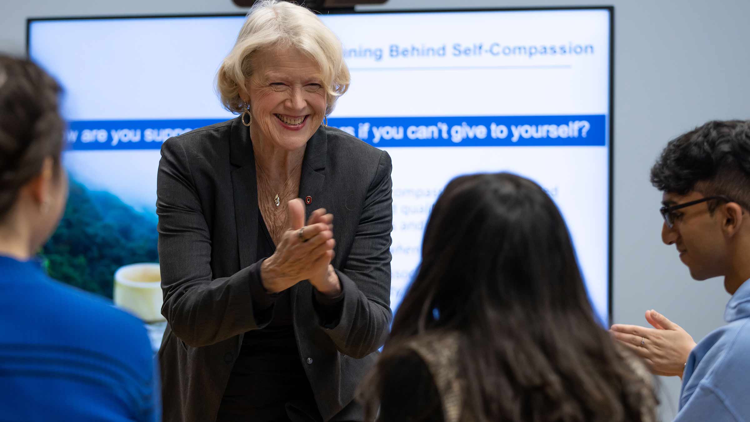 Dr. Klatt smiling as she is working with the students