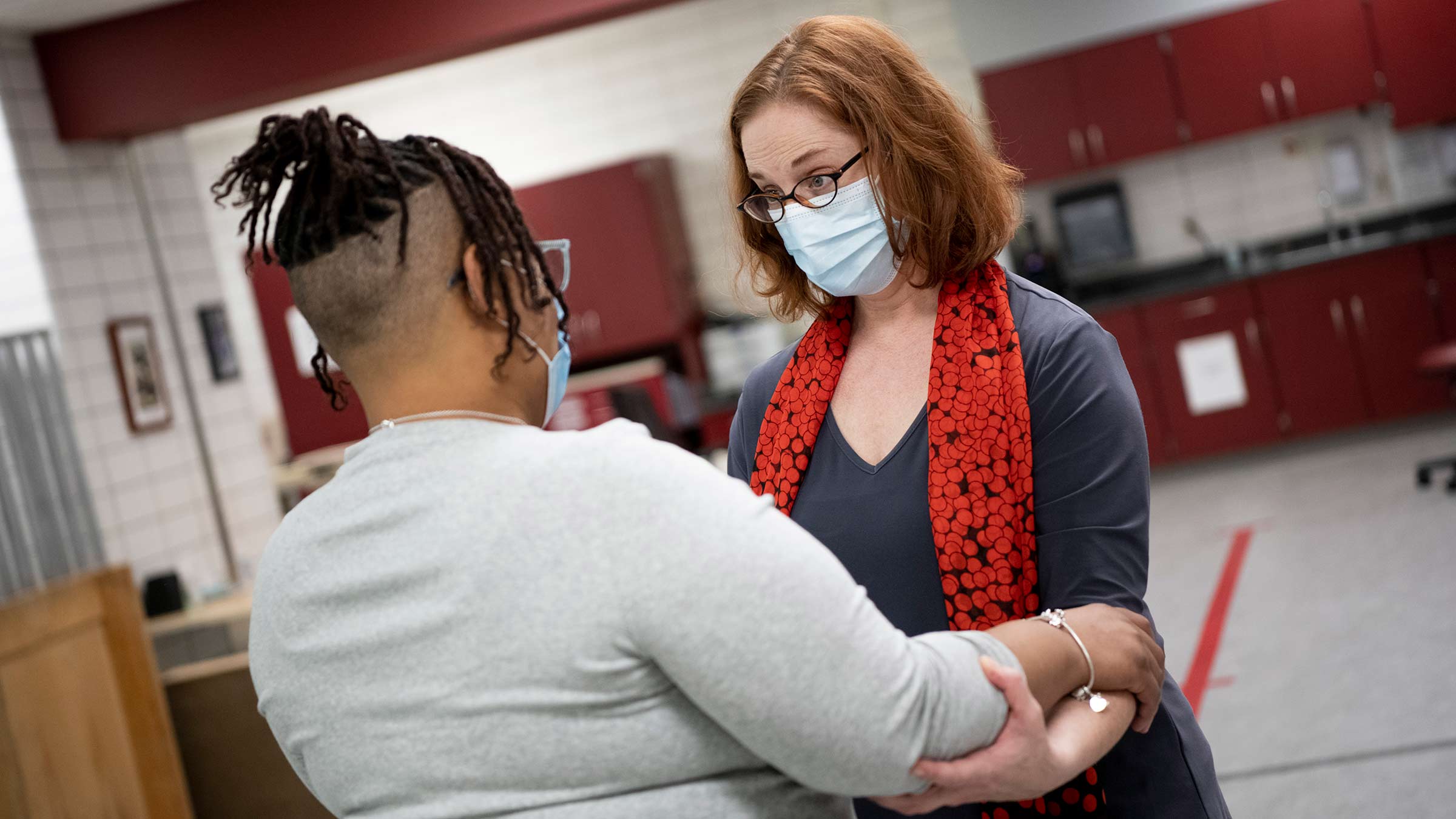 A physical therapist helping a patient