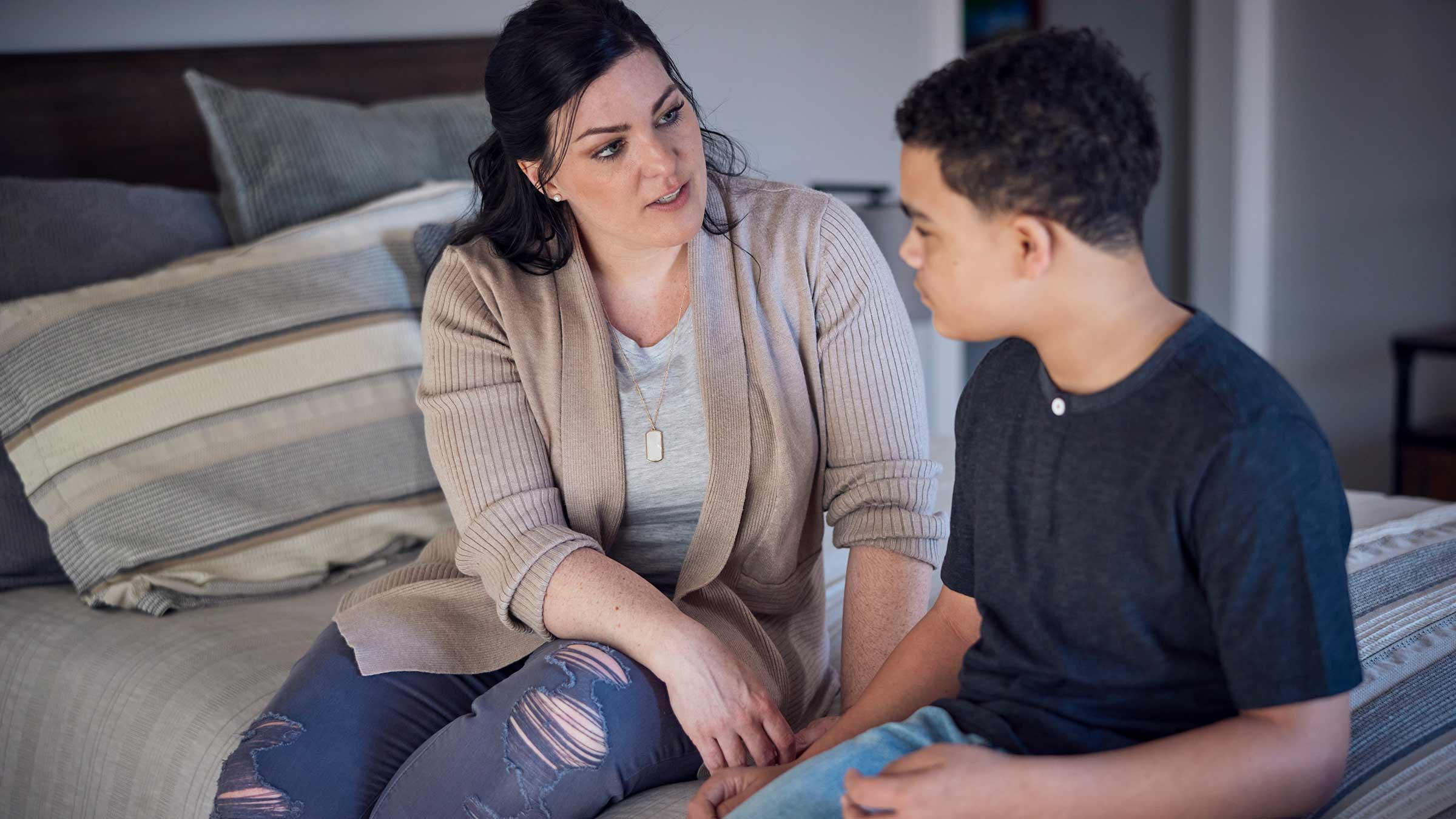 A mother having a conversation with her son