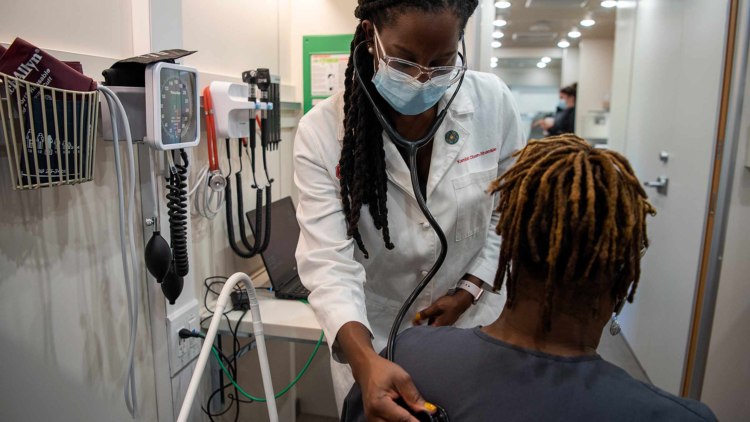 Dr. Kamilah Dixon examining a patient
