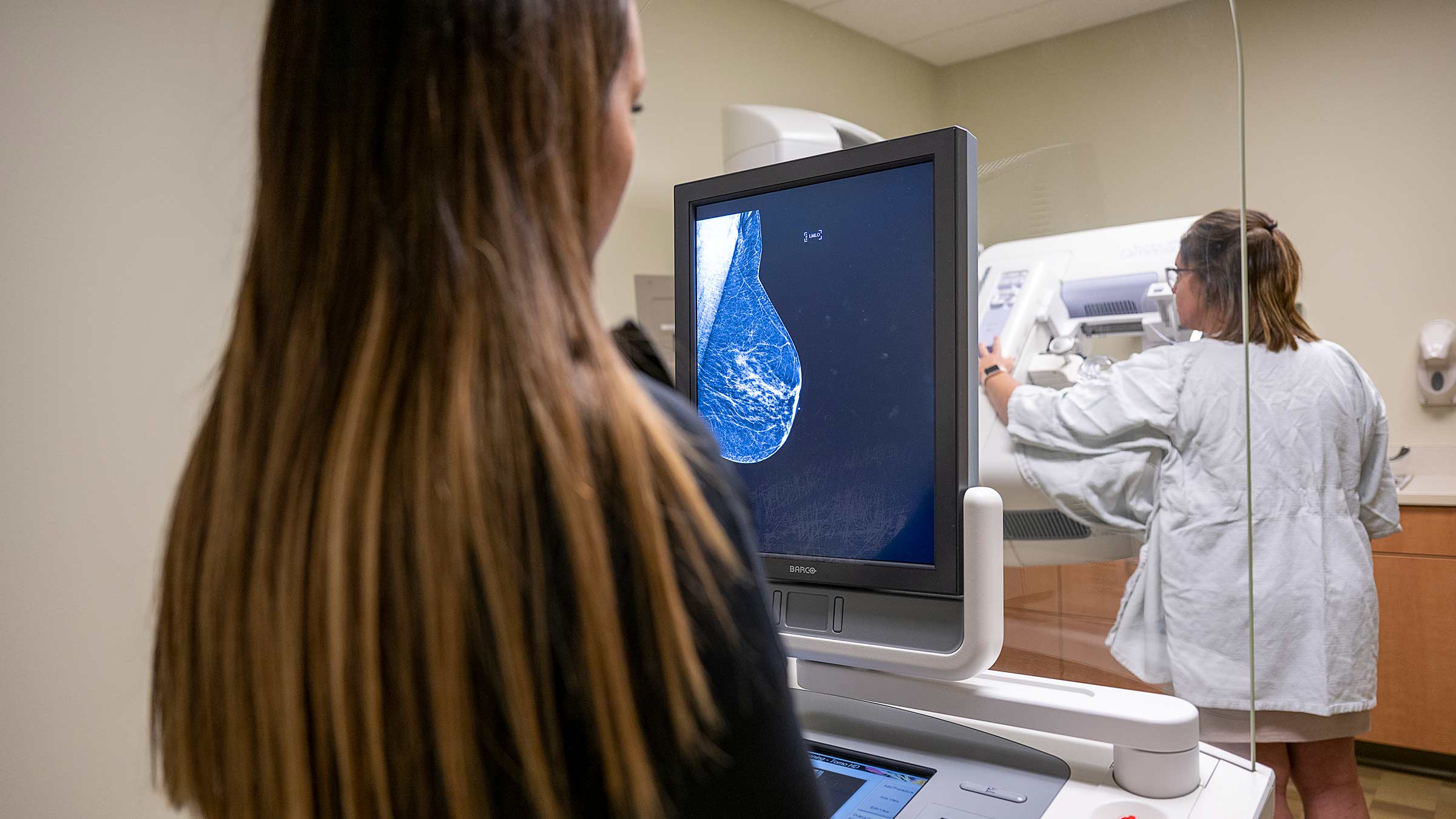 Radiologist looking at a breast scan on the screen