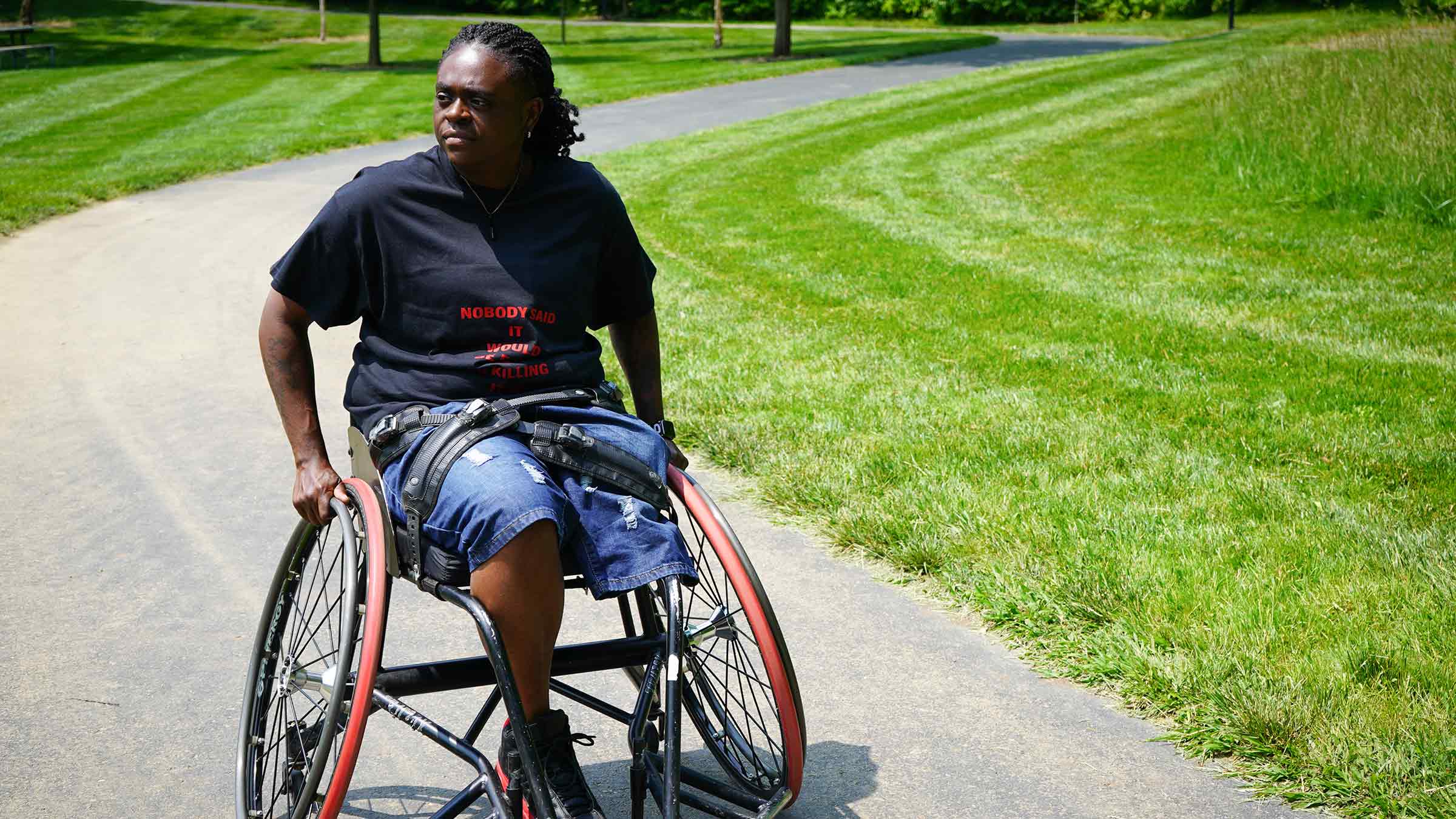 Laquinta Haynes in a wheelchair in a park