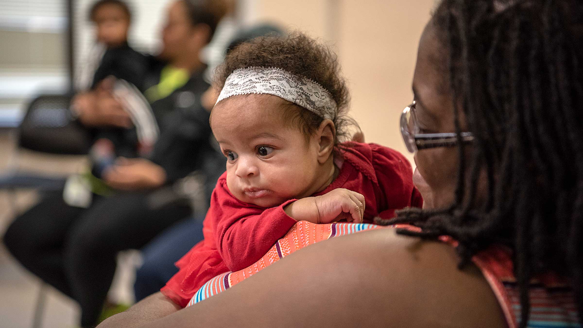 A woman holding a baby