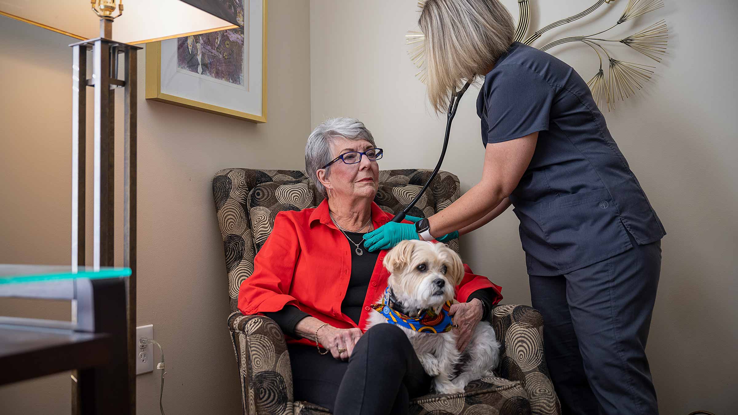 Nurse listening to a patient's heart