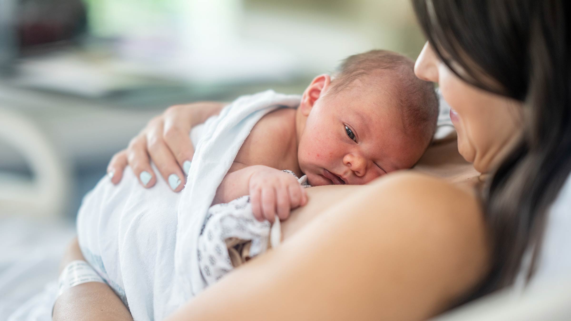 A mother with a newborn on her chest