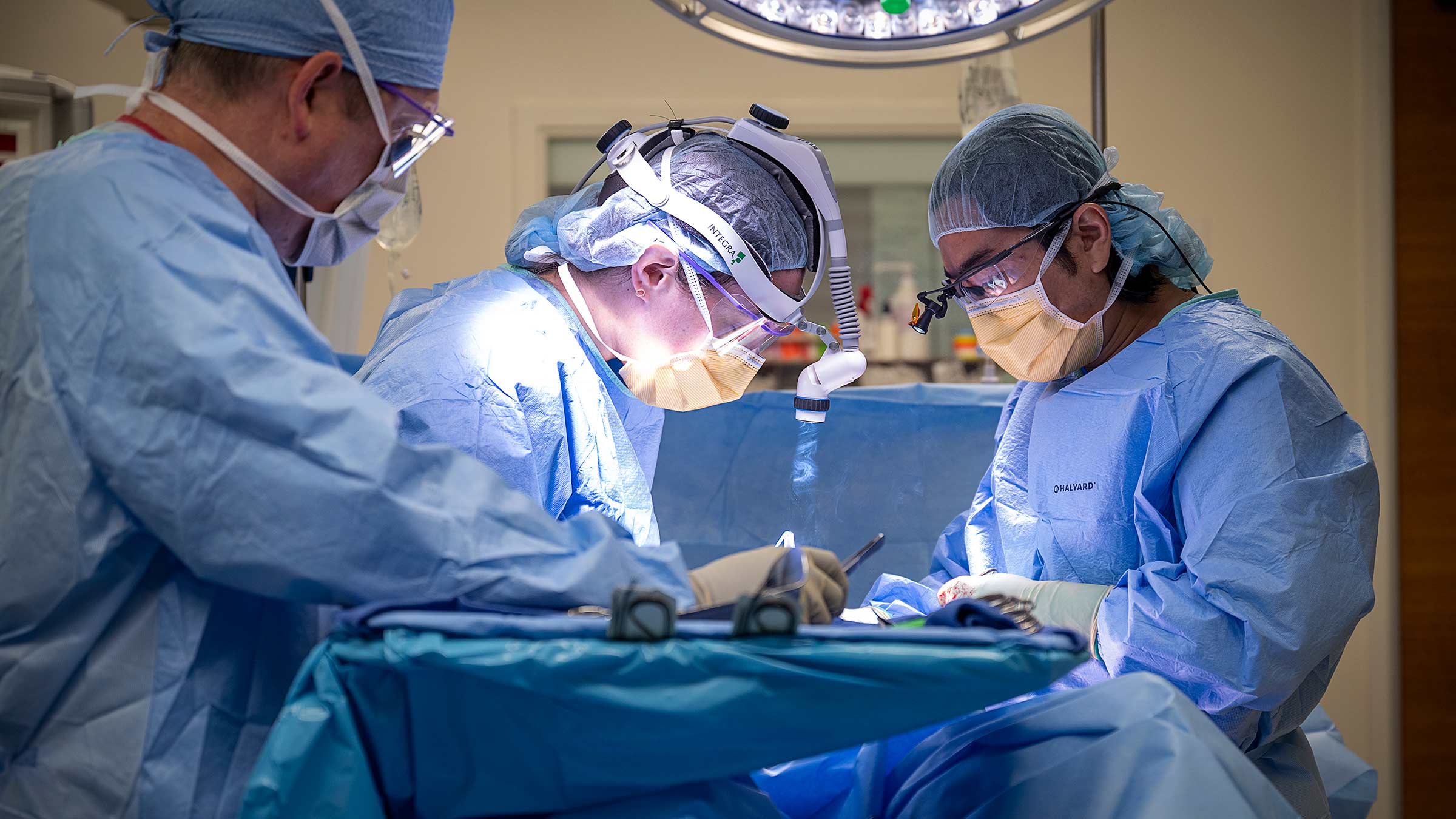 Dr. Kim with his team performing a surgery