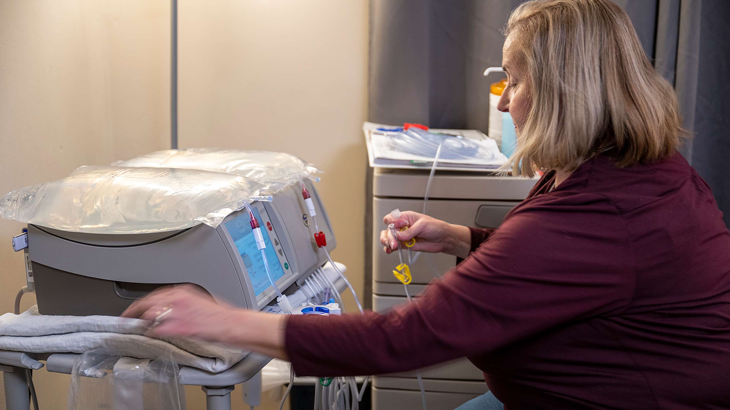 Steve's wife Tammy adjusting the dialysis machine