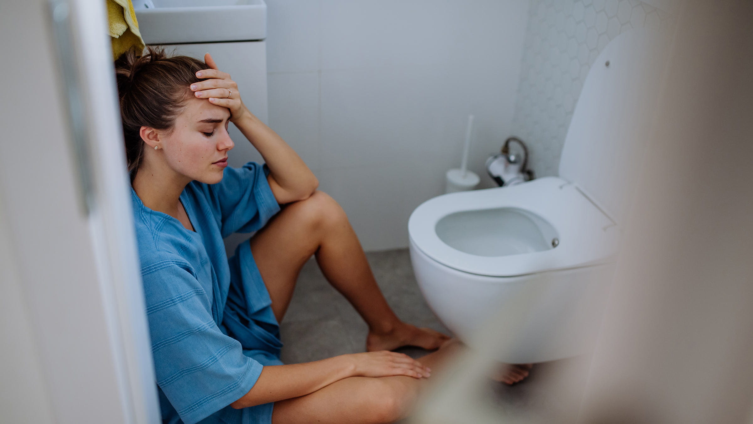 A young pregnant woman experiencing morning sickness