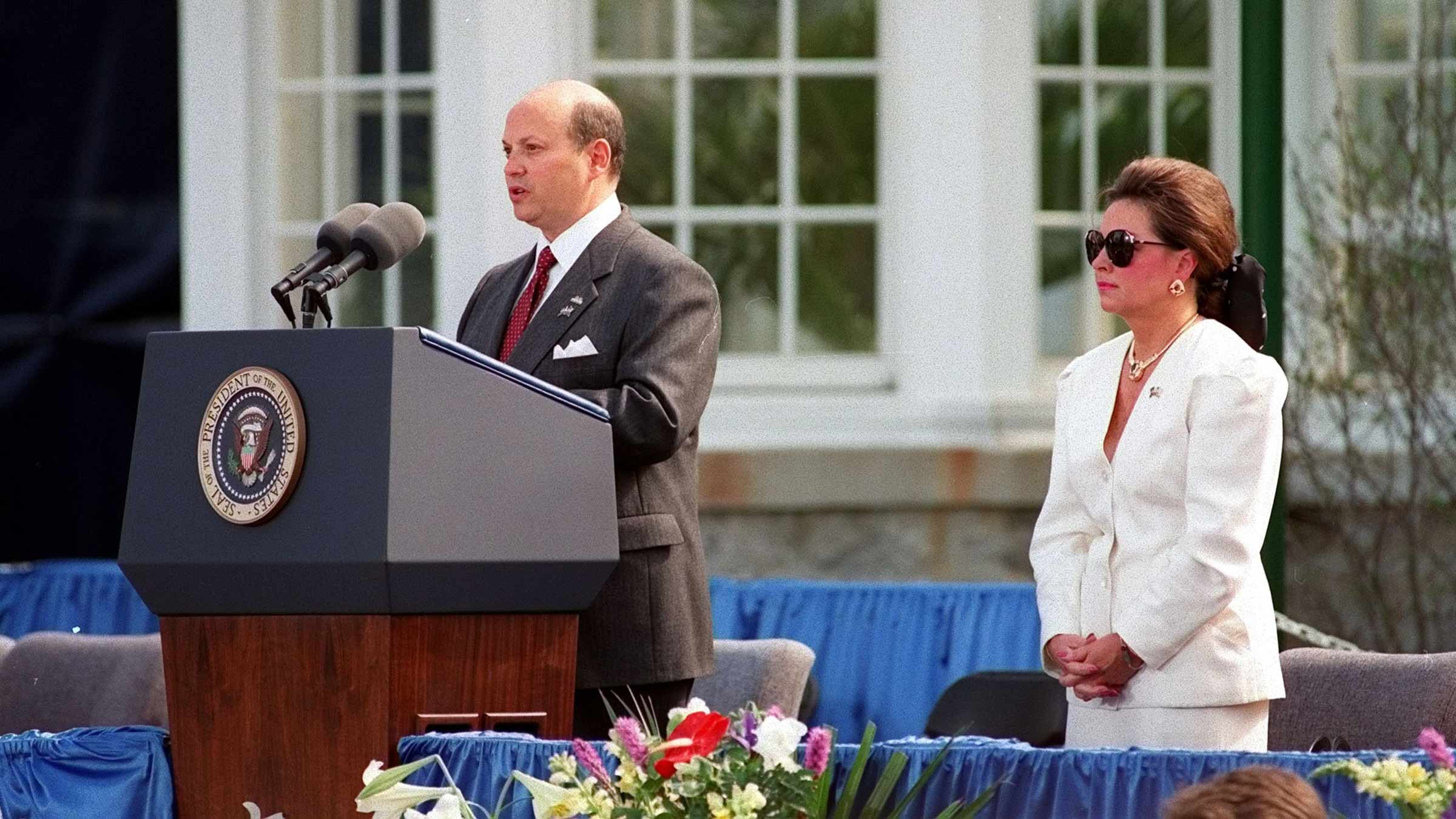John F. Wolfe and his wife, Ann, at a speaking engagement
