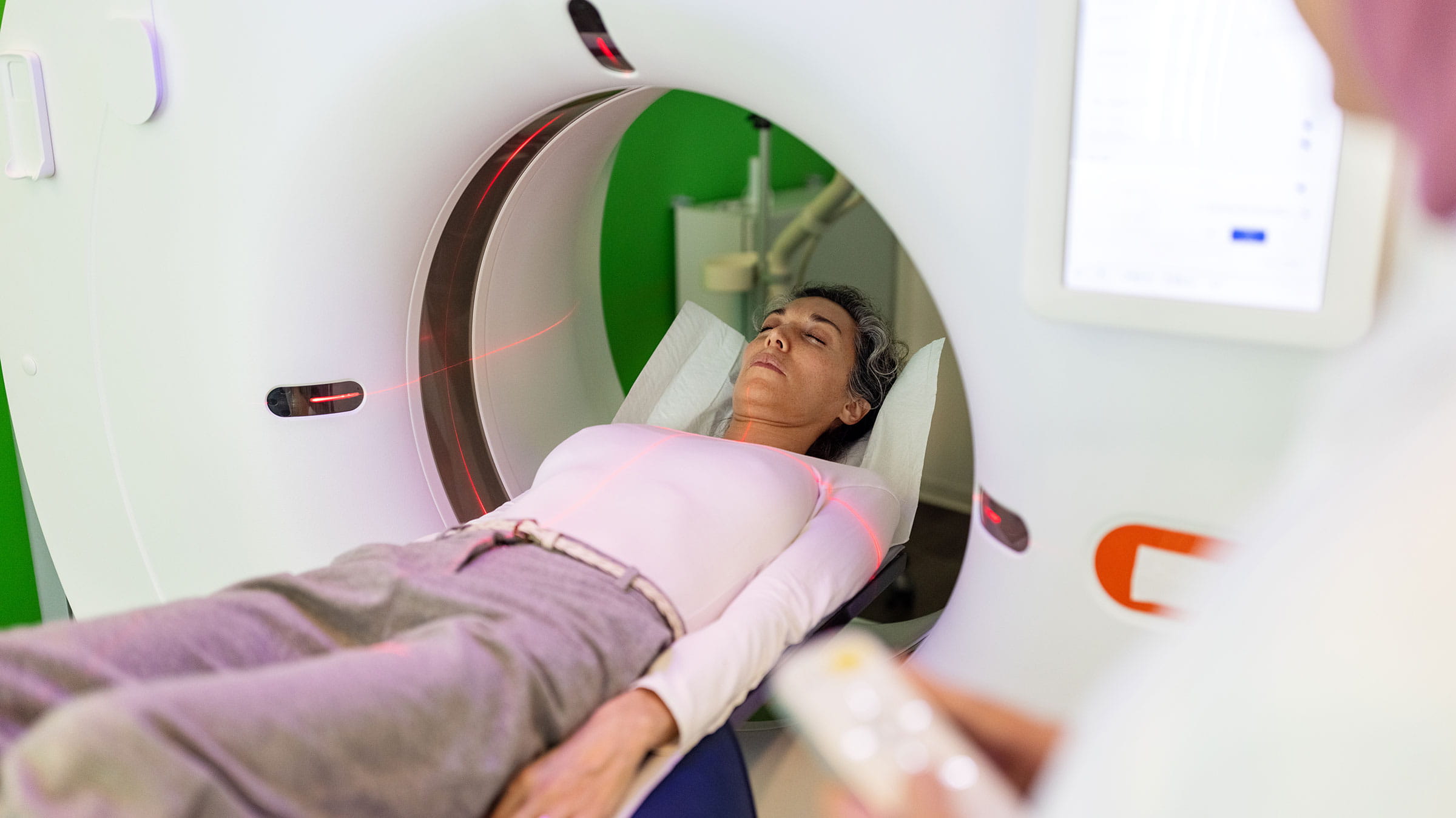 Female patient undergoes a CT scan for heart screening