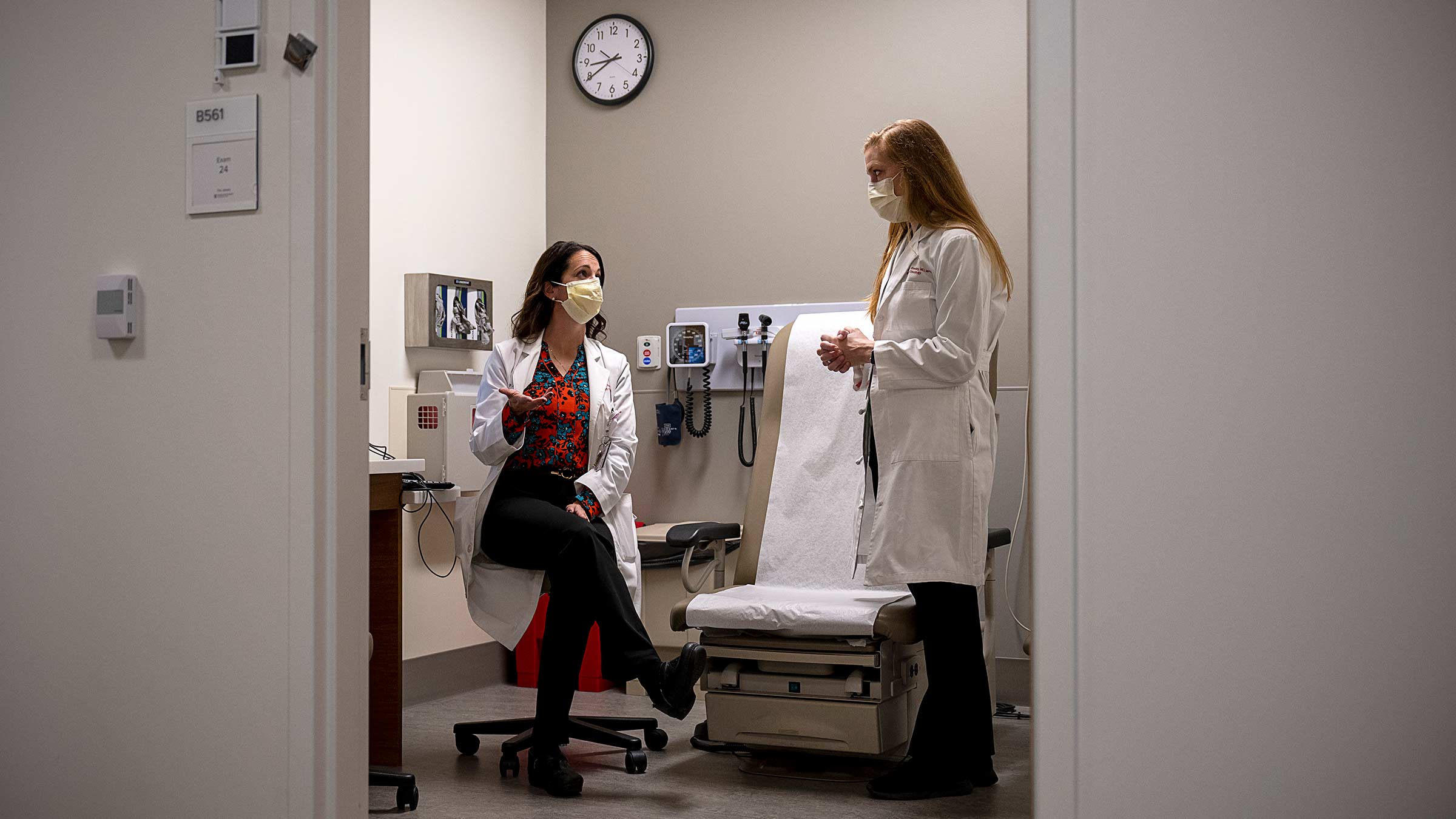 Two doctors talking in the exam room