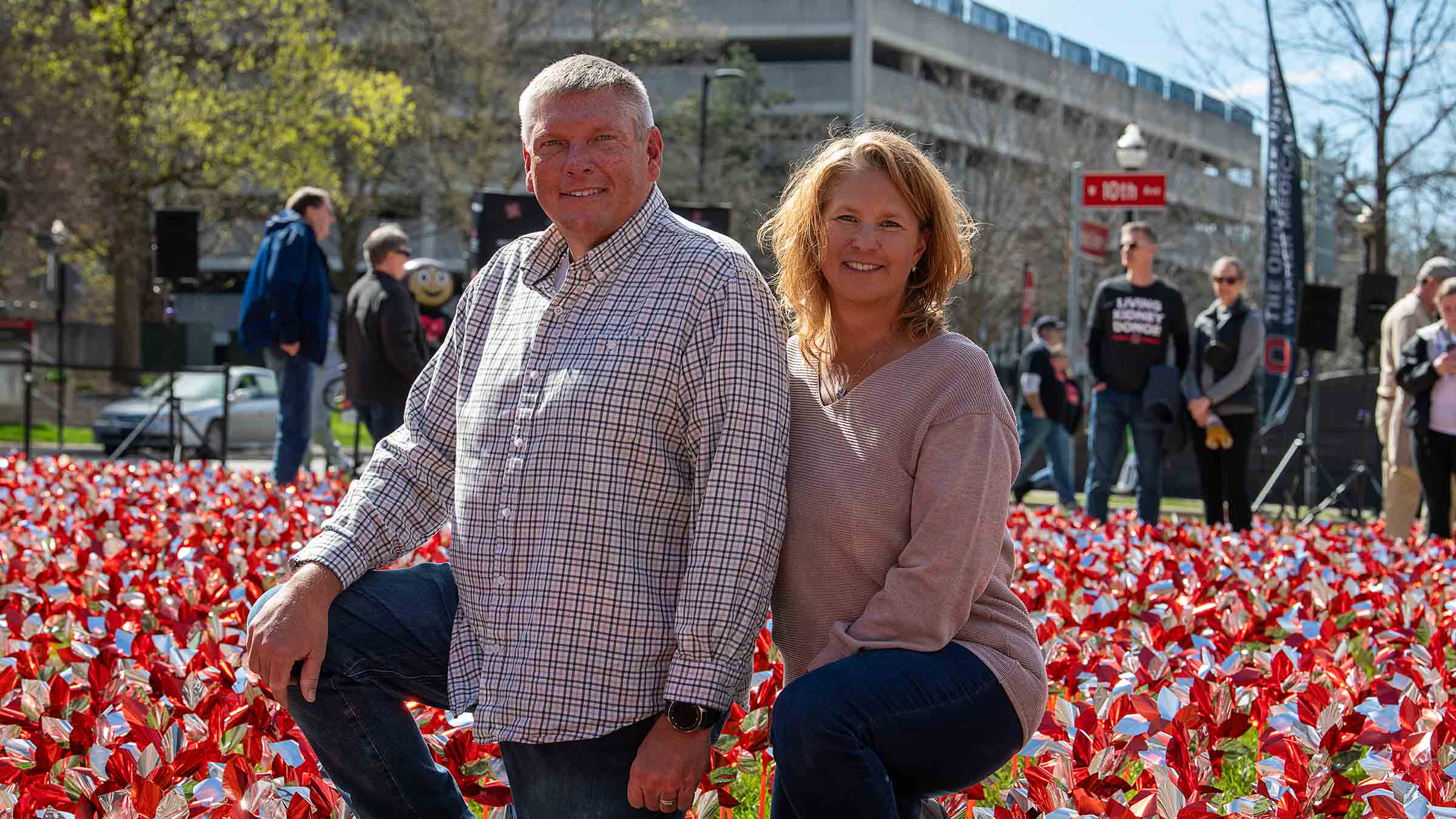 Scott Griffith with his wife, Krisi, among pinwheels