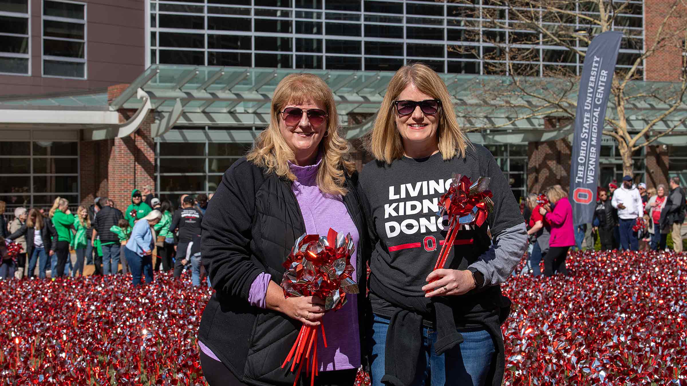 Kelly Creedon with her donor, her sister Anne Marie, in the field of pinwheels