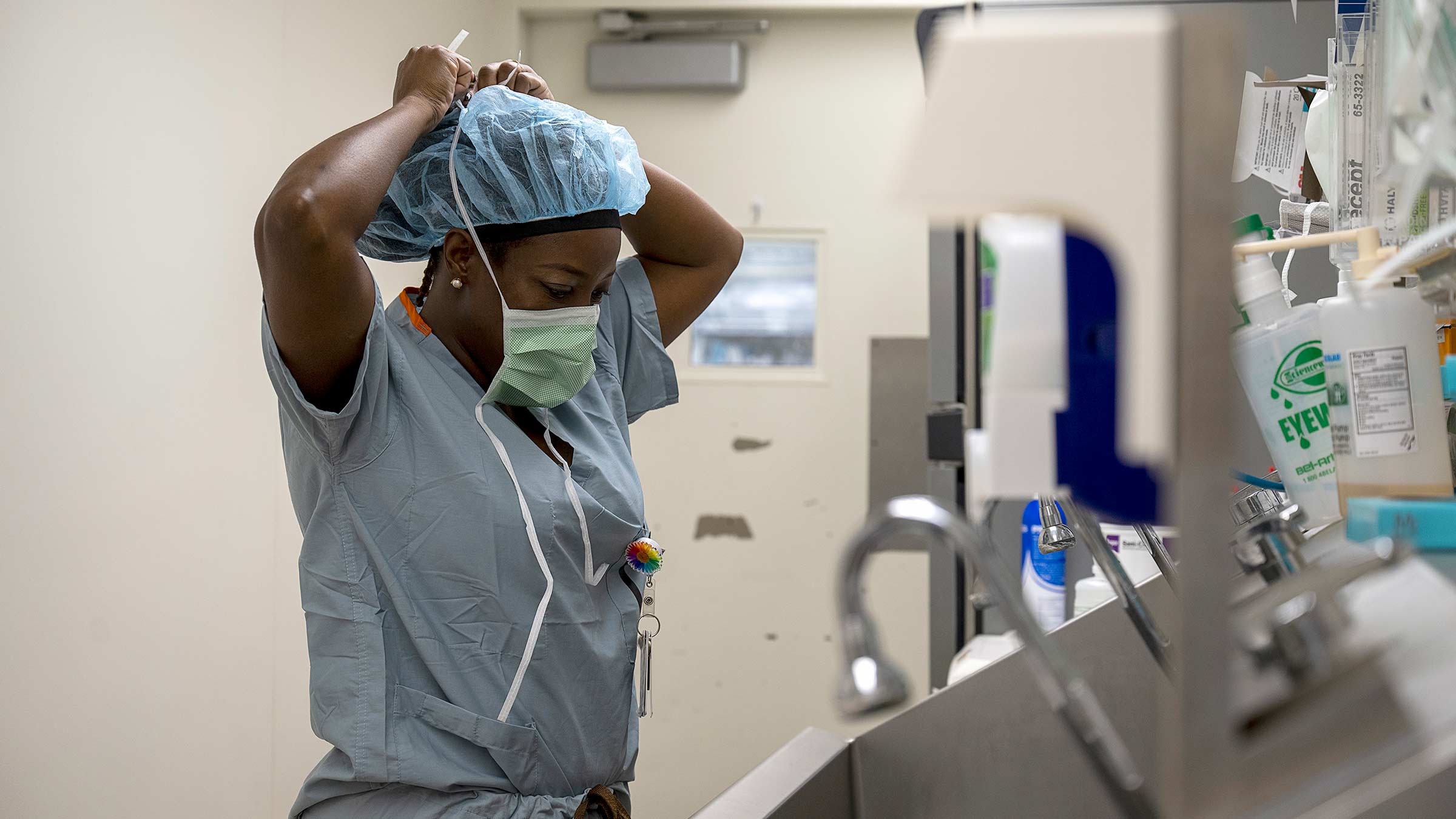 Dr. Kerry-Ann Mitchell preparing for surgery in the OR