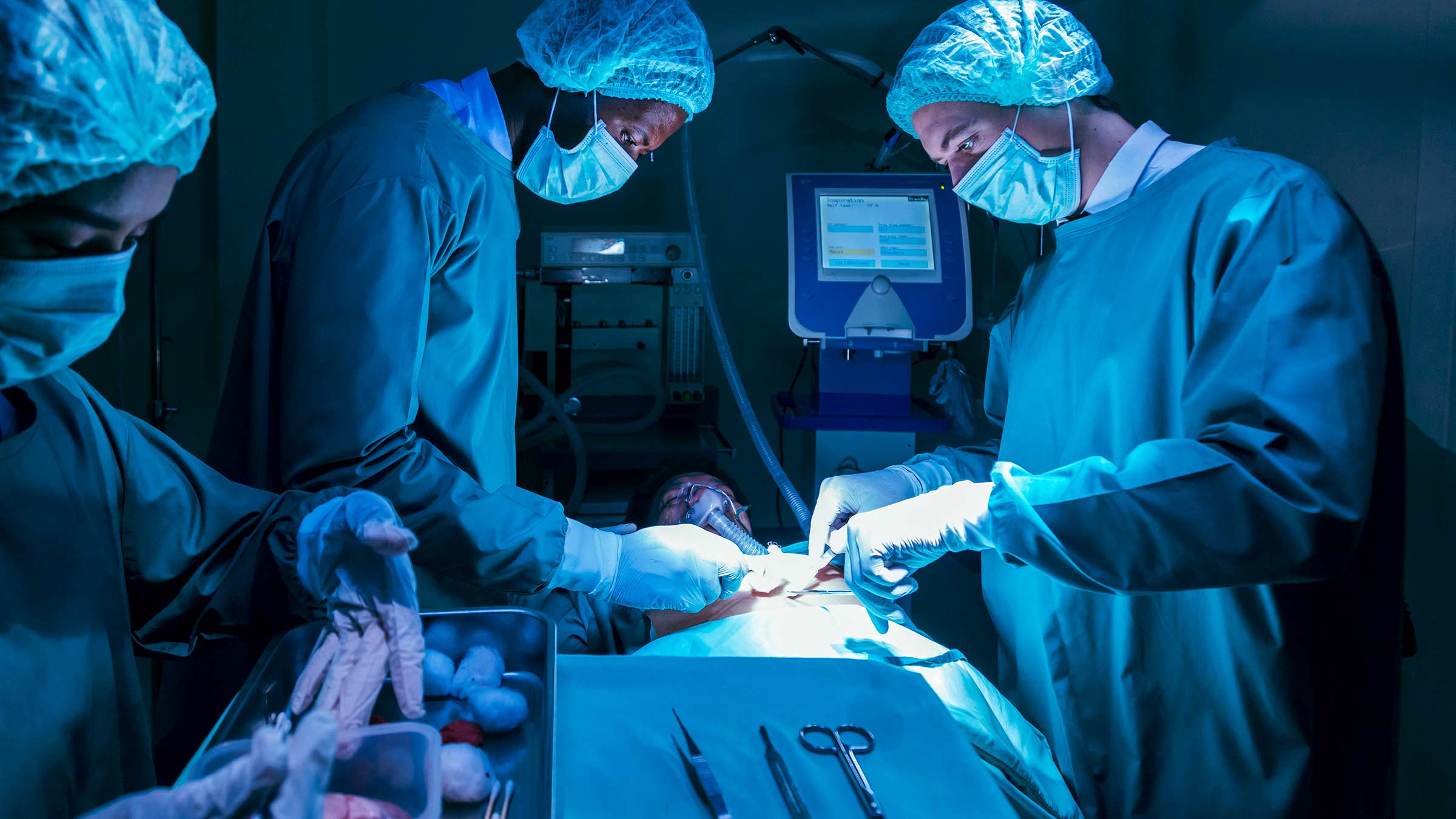 Team of surgeons performing a transplant procedure