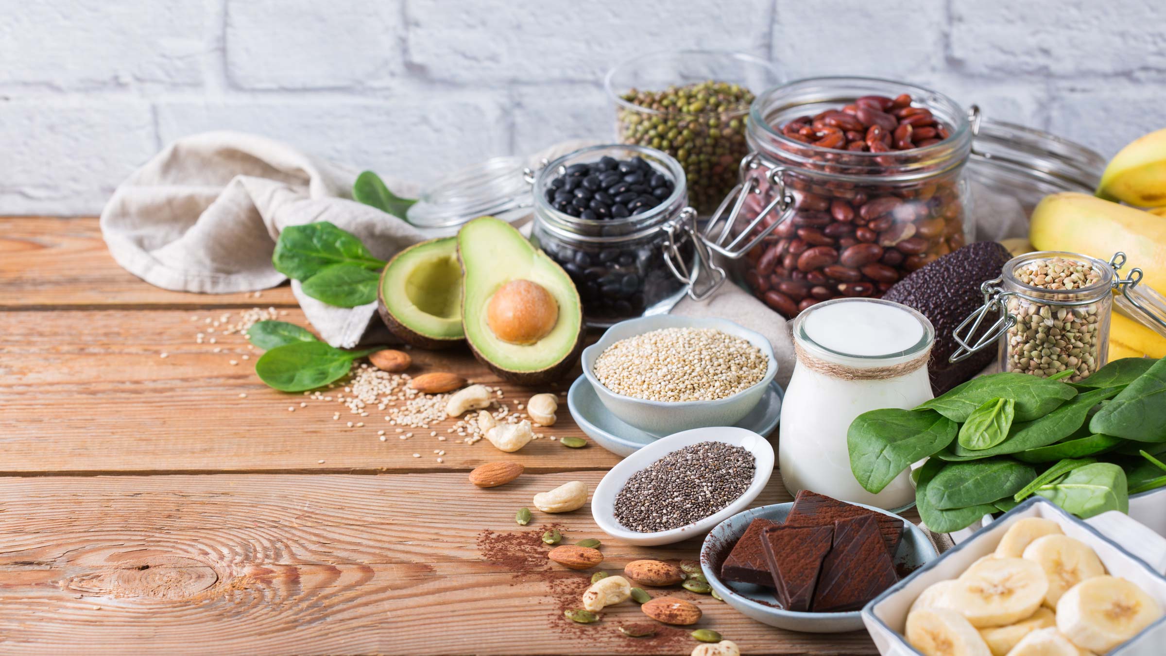 Avocados, bananas, and other magnesium-rich foods on a table