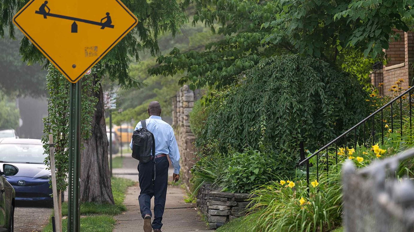 Dr. Doubeni walking on the street