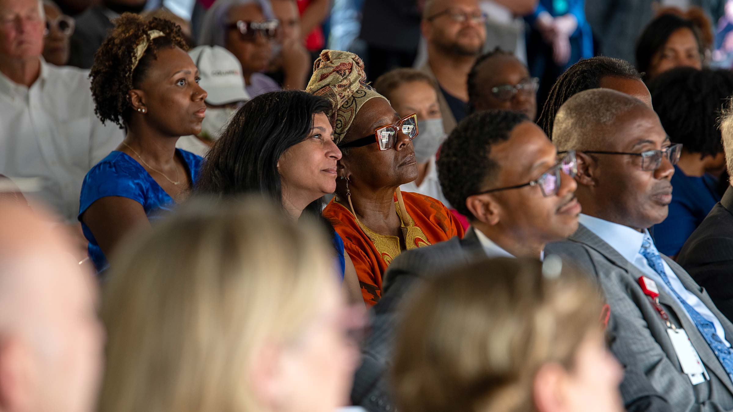 a crowd watching speech at the opening of Ohio State’s Healthy Community Center