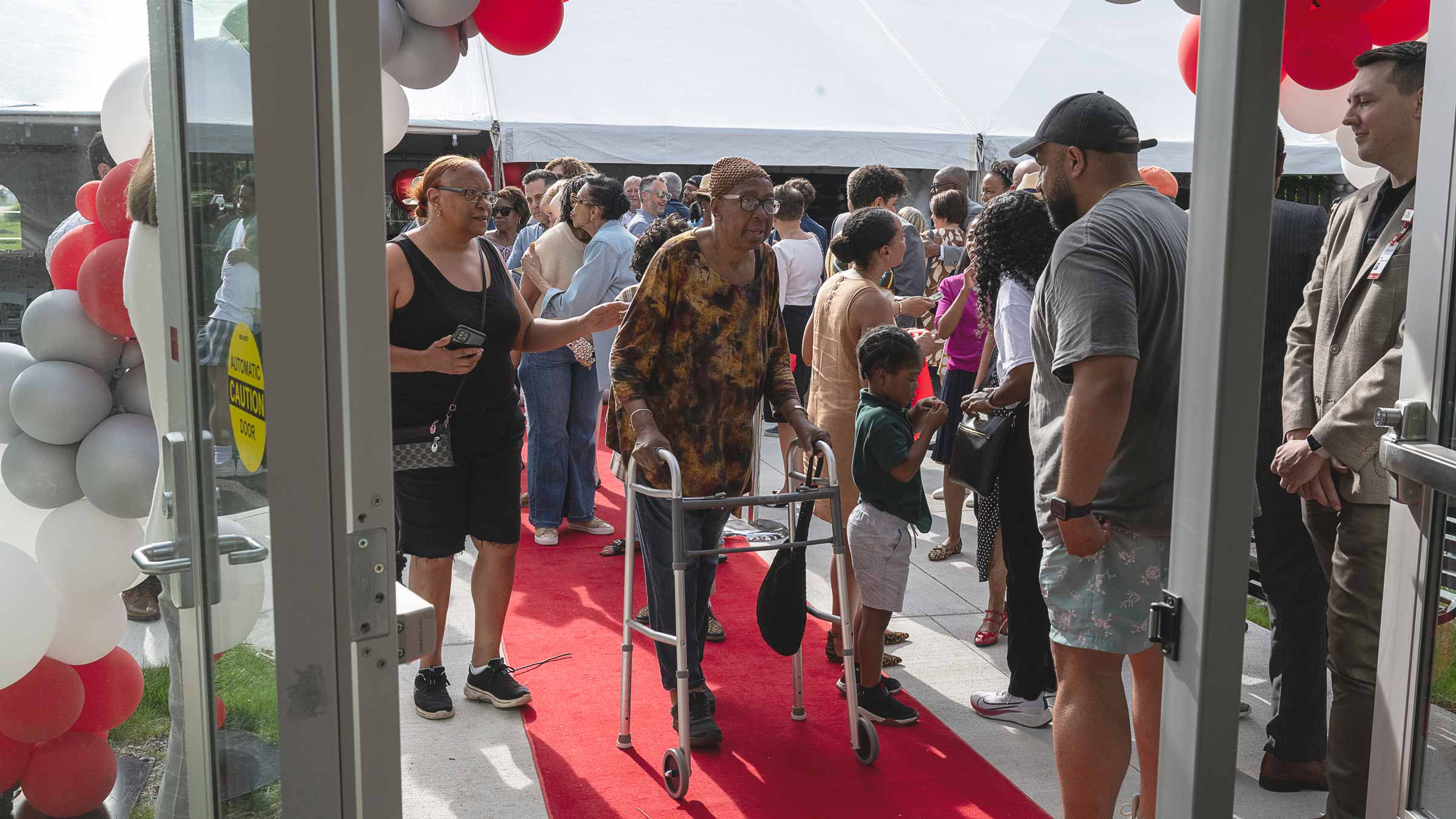 people walking into the new Ohio State Healthy Community Center opening event