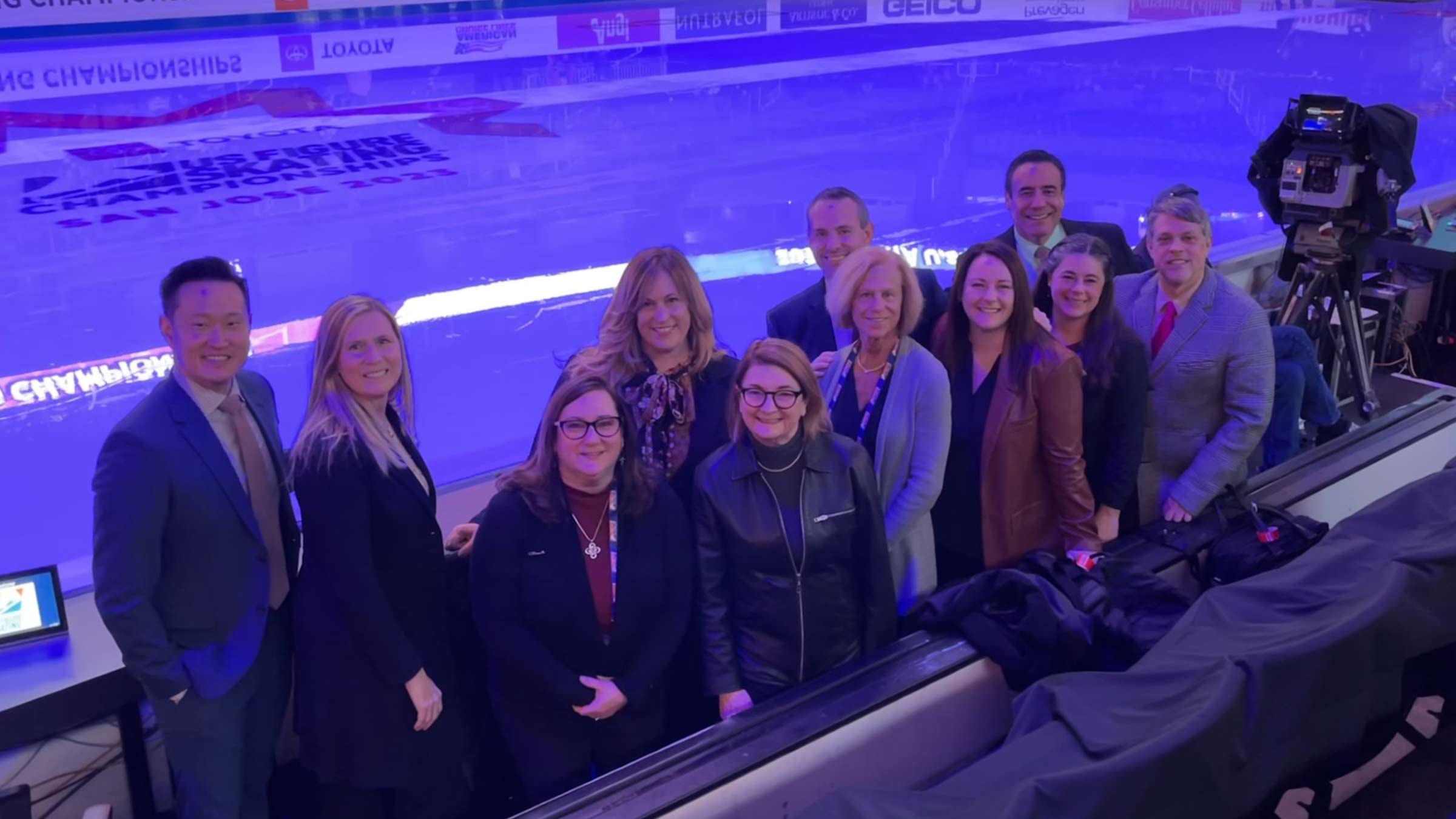 Dr. Luke with a group of other judges at a figure skating event