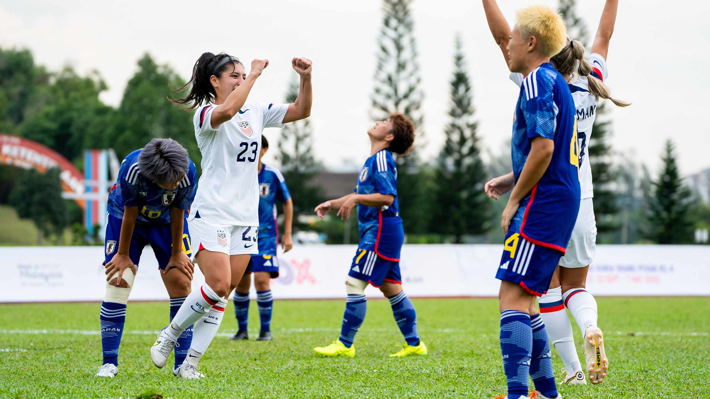 Casey King cheering with her teammates during a soccer game