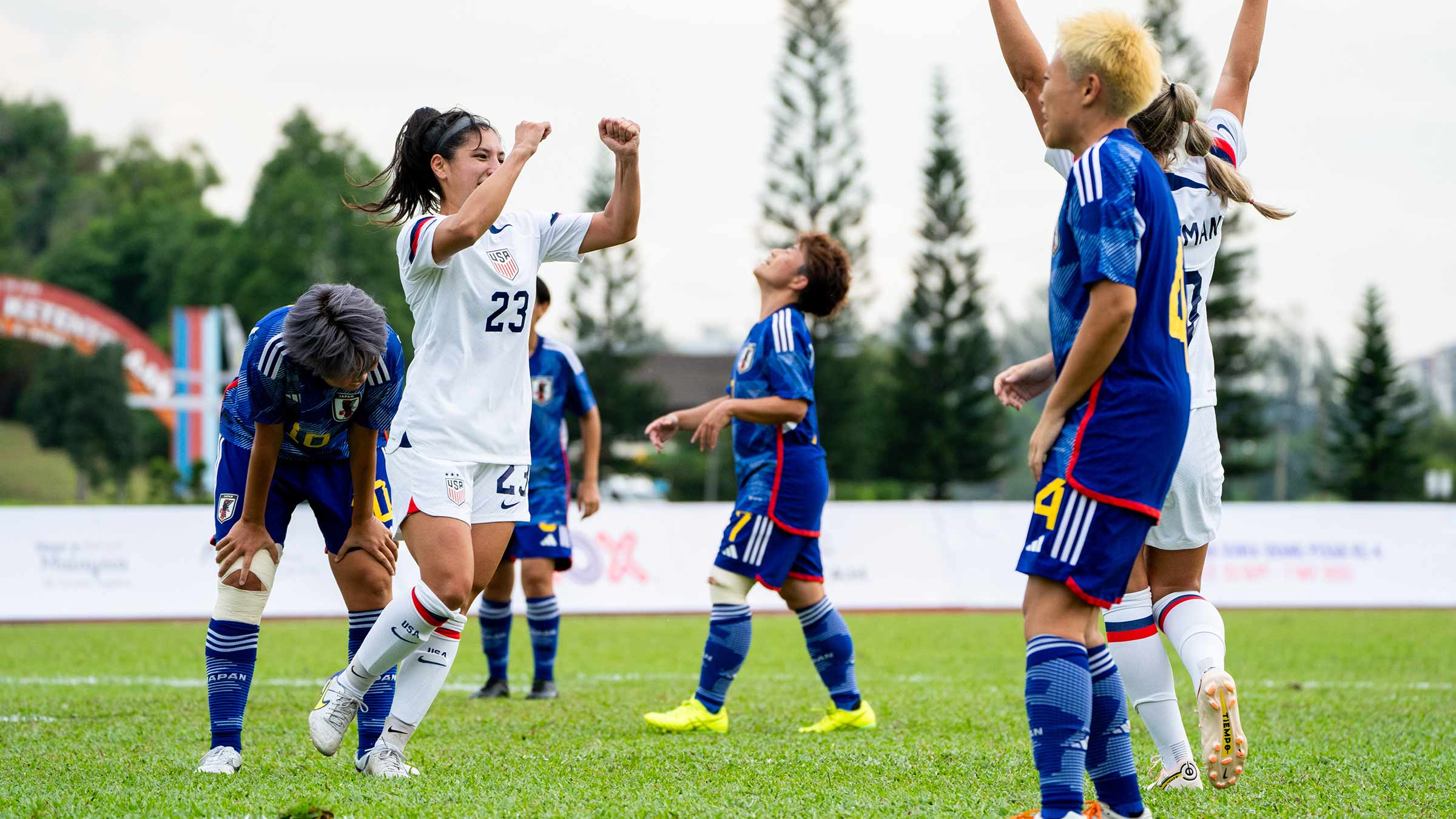 Casey King cheering with her teammates during a soccer game