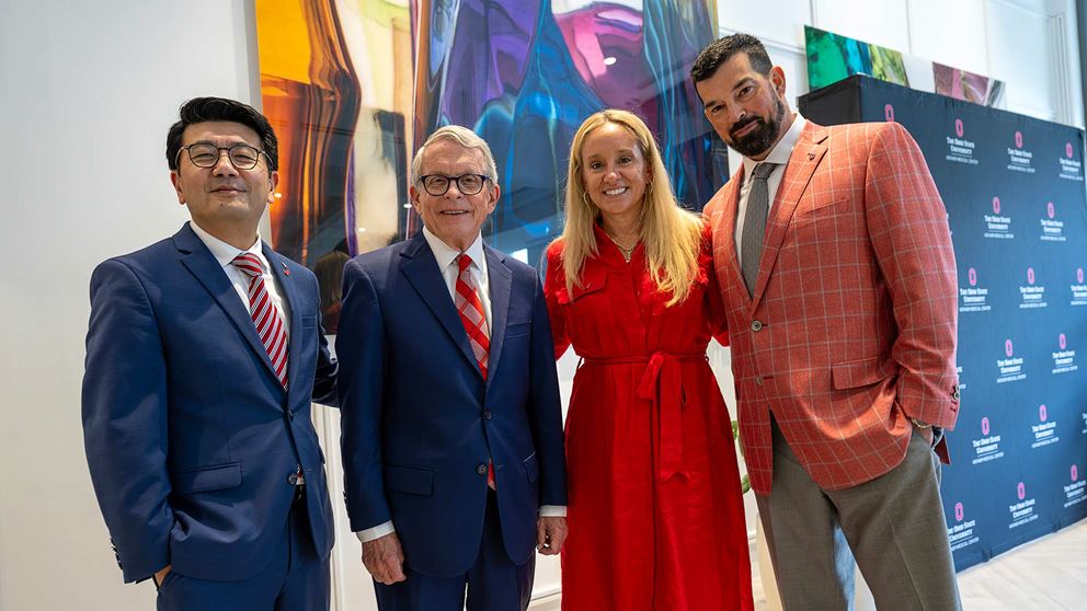 Ohio State head football coach Ryan Day, his wife Christina Day, Ohio Govenor Mike DeWine, and Dr. K. Laun Phan, MD posing for a group picture