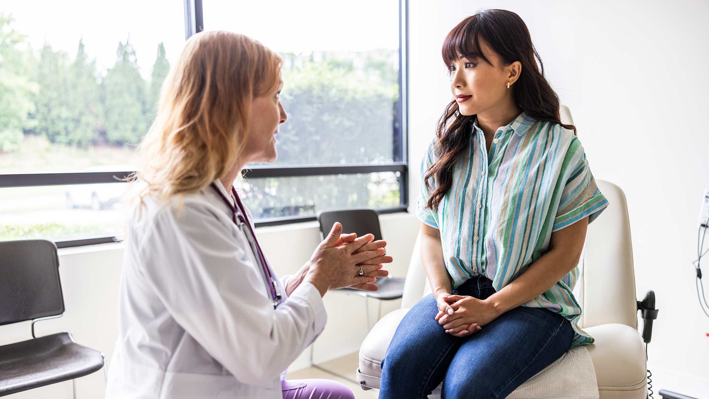 Doctor talking to a patient in the exam room