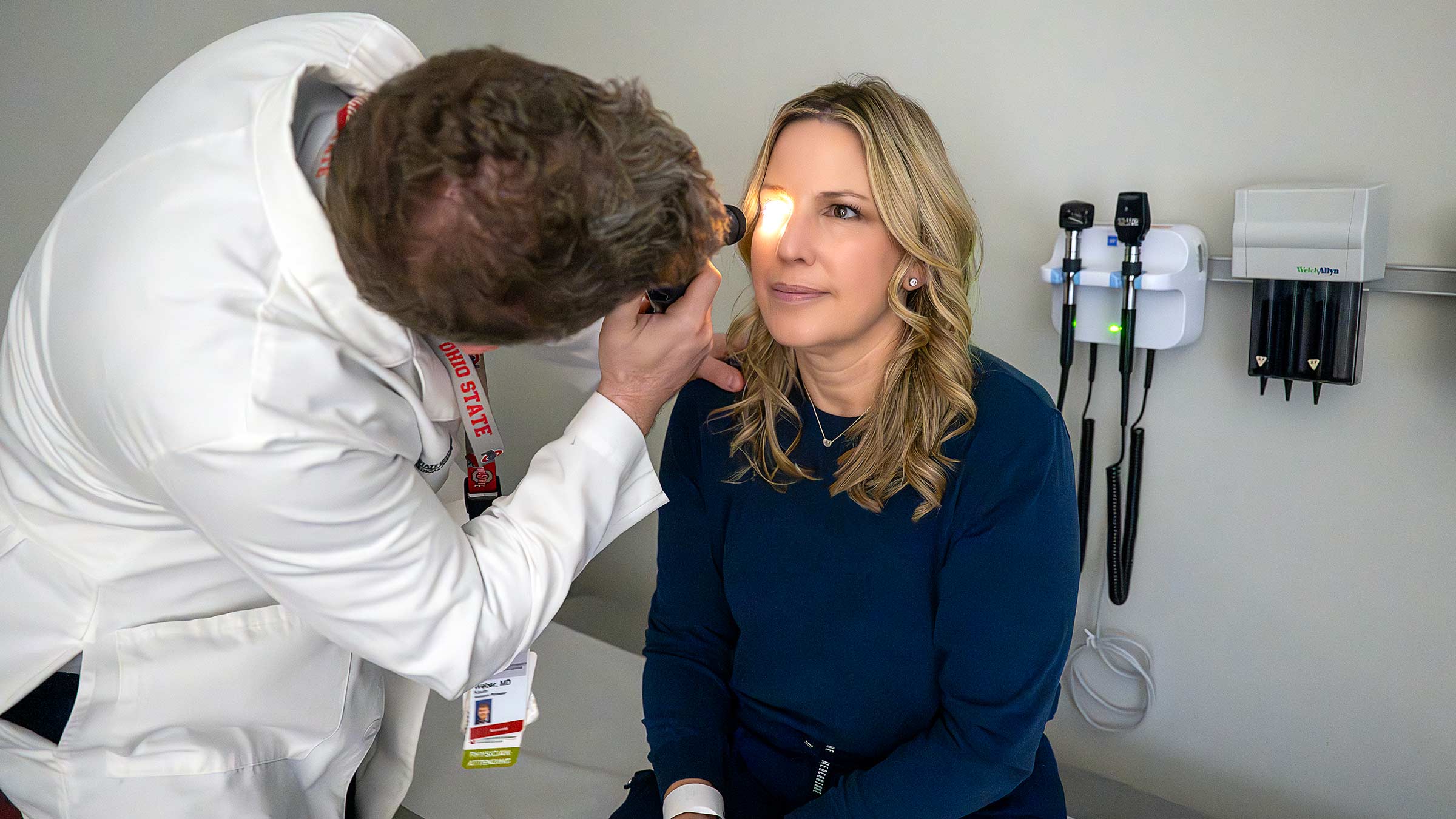 Dr. Weber checking a patient's pupils