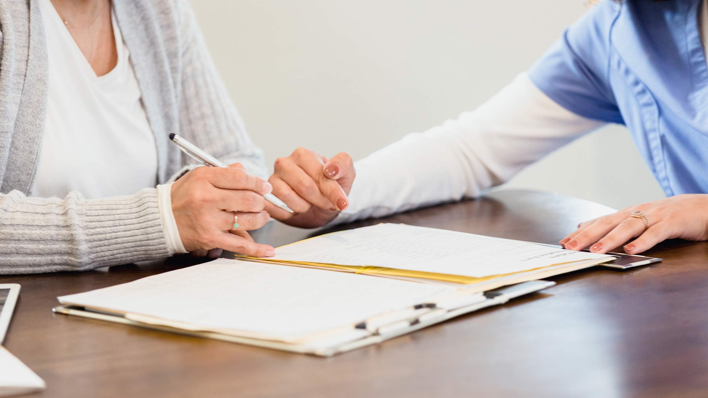 Two people going over an end-of-life plan legal document