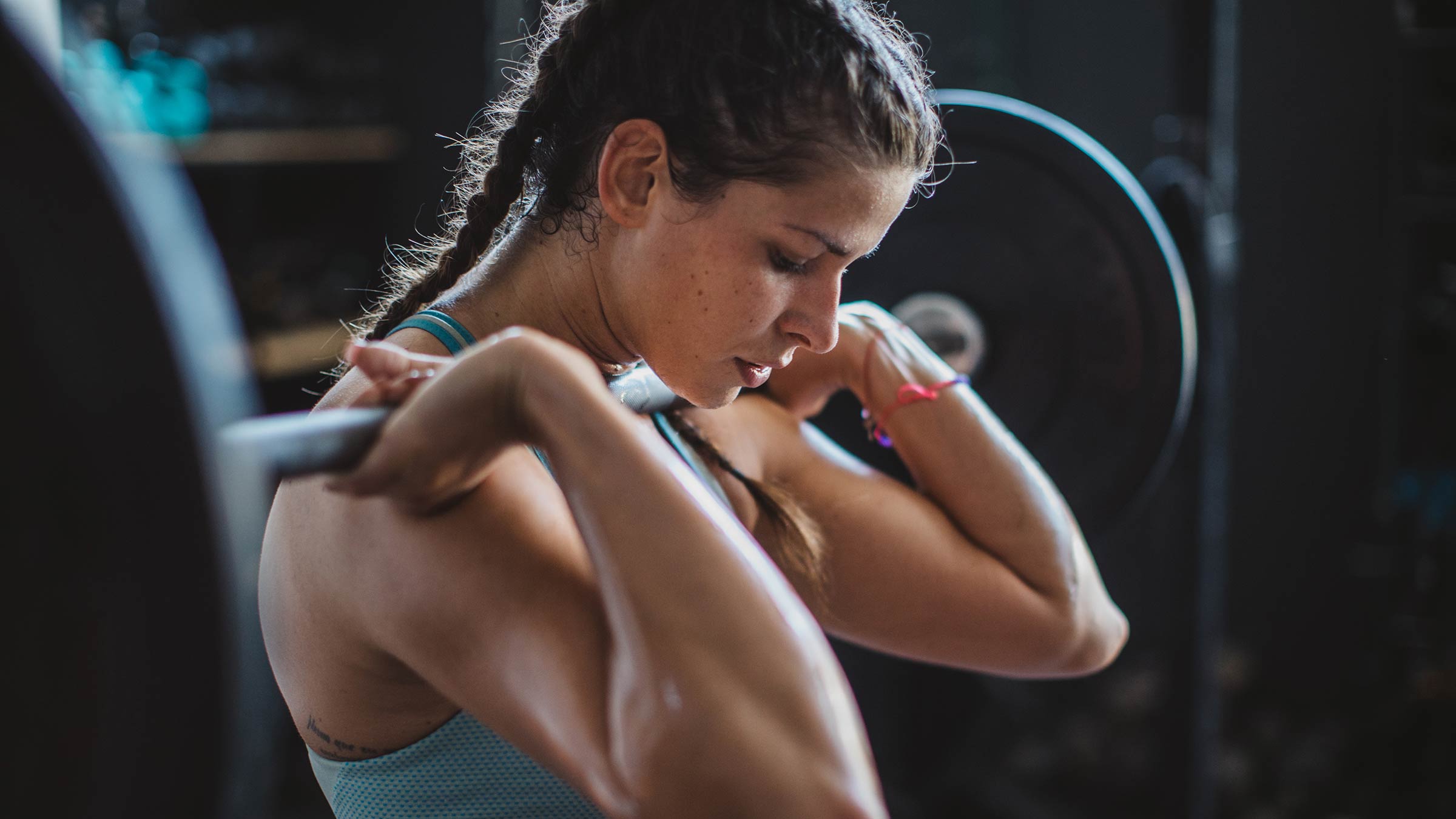 A woman weightlifting at a gym