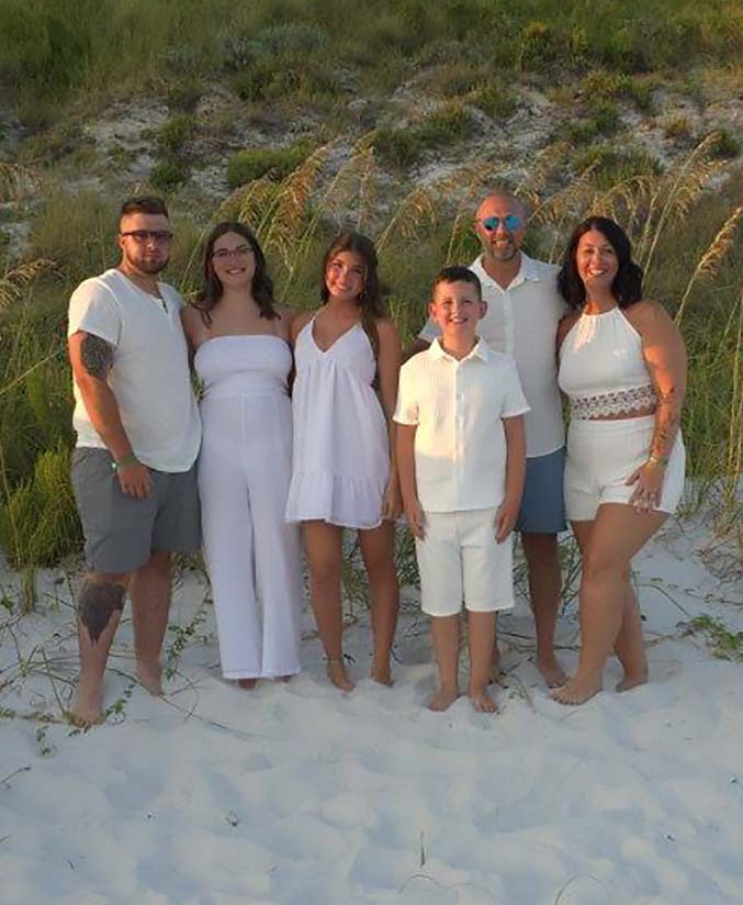 Melissa Plummer with her family at the beach