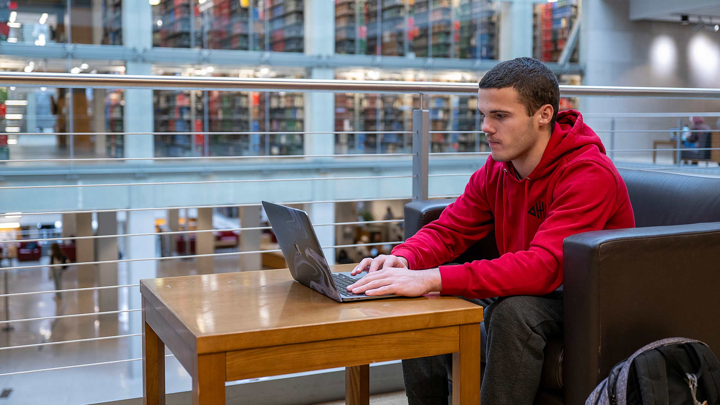 Grayson Niemi doing schoolwork on his laptop