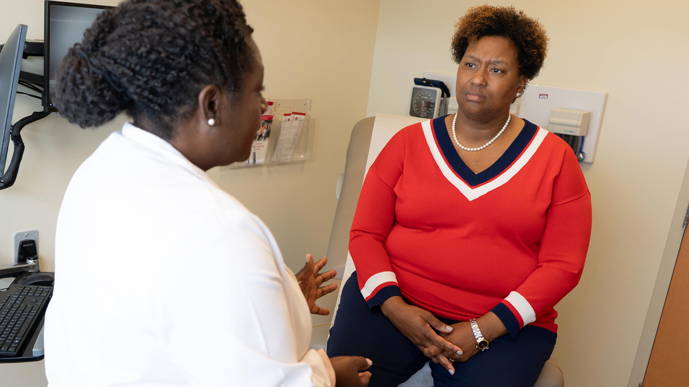 Dr. Oppong talking to a patient