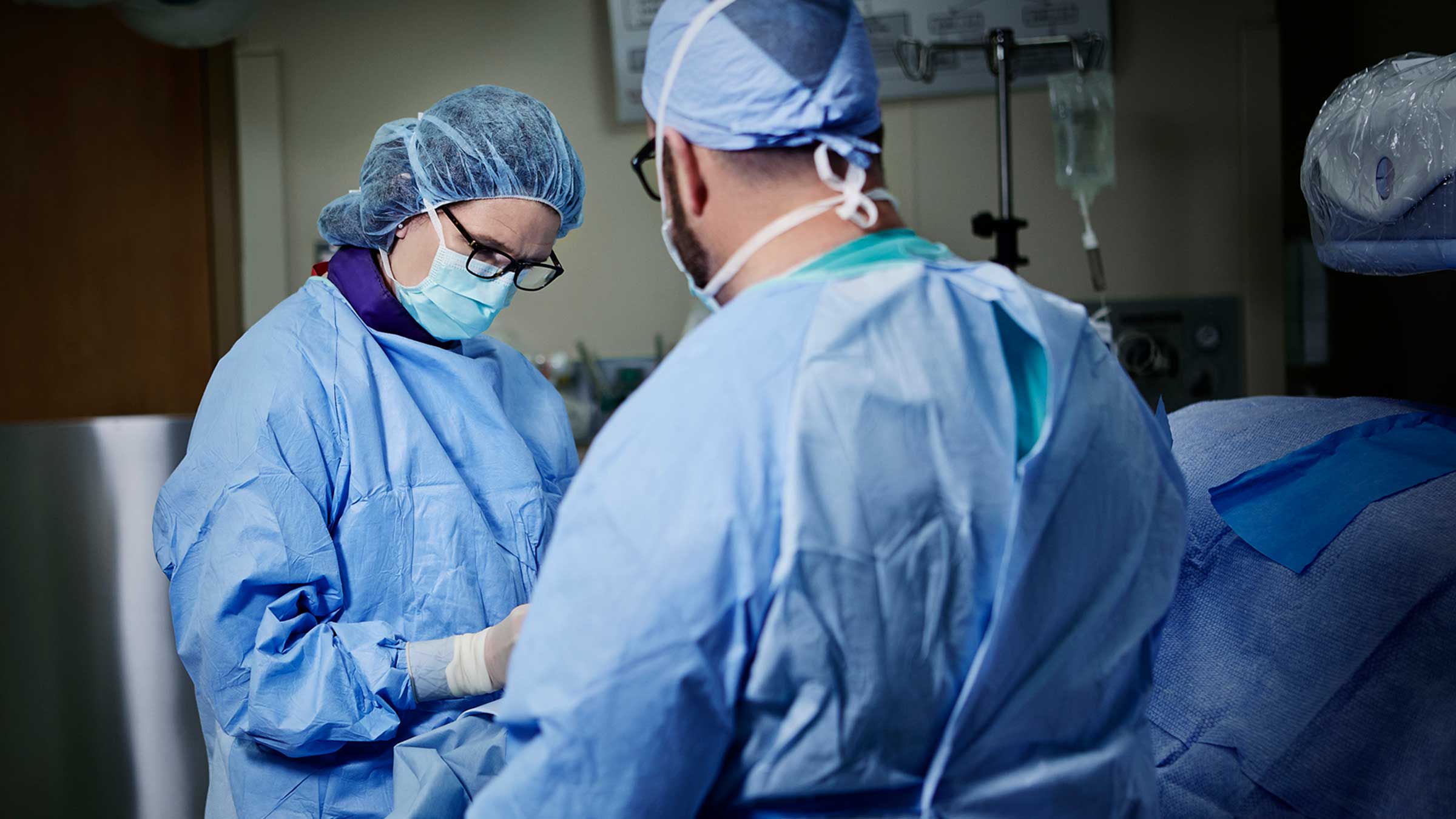 Interventional cardiologists performing a minimally invasive valve replacement