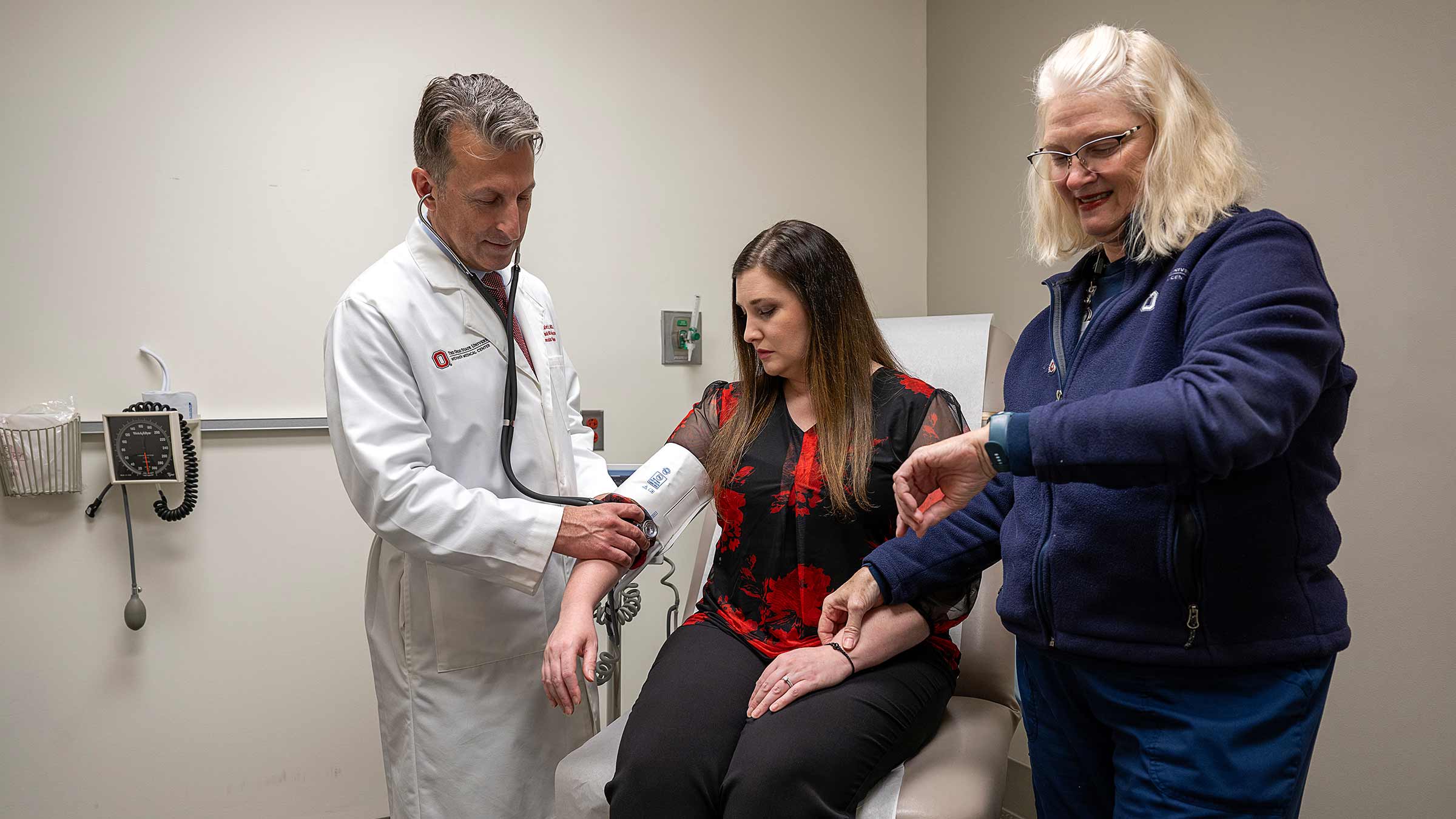 Dr. Ernest Mazzaferri Jr. examining a patient