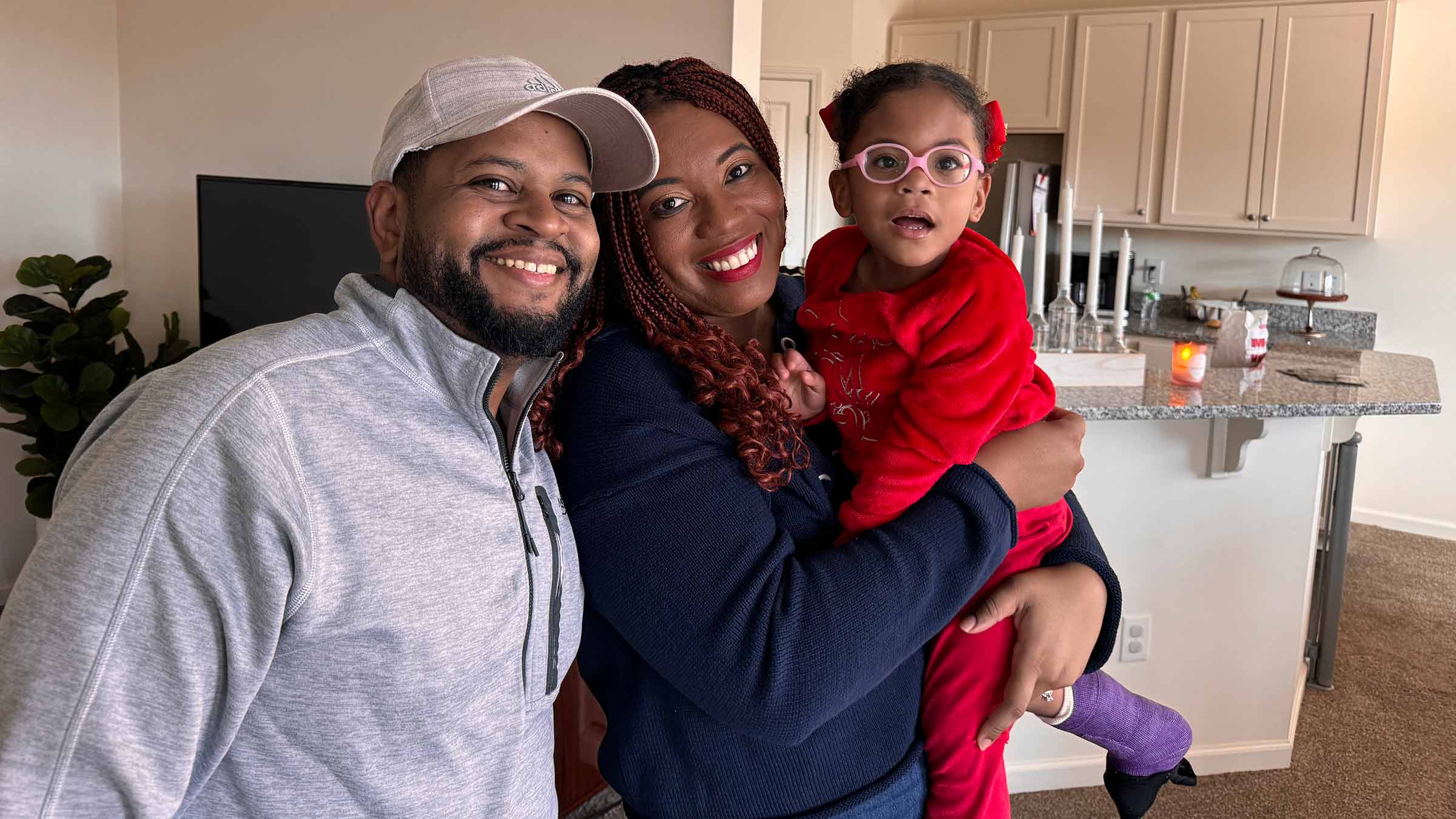 Ebony Wilson with her husband and daughter