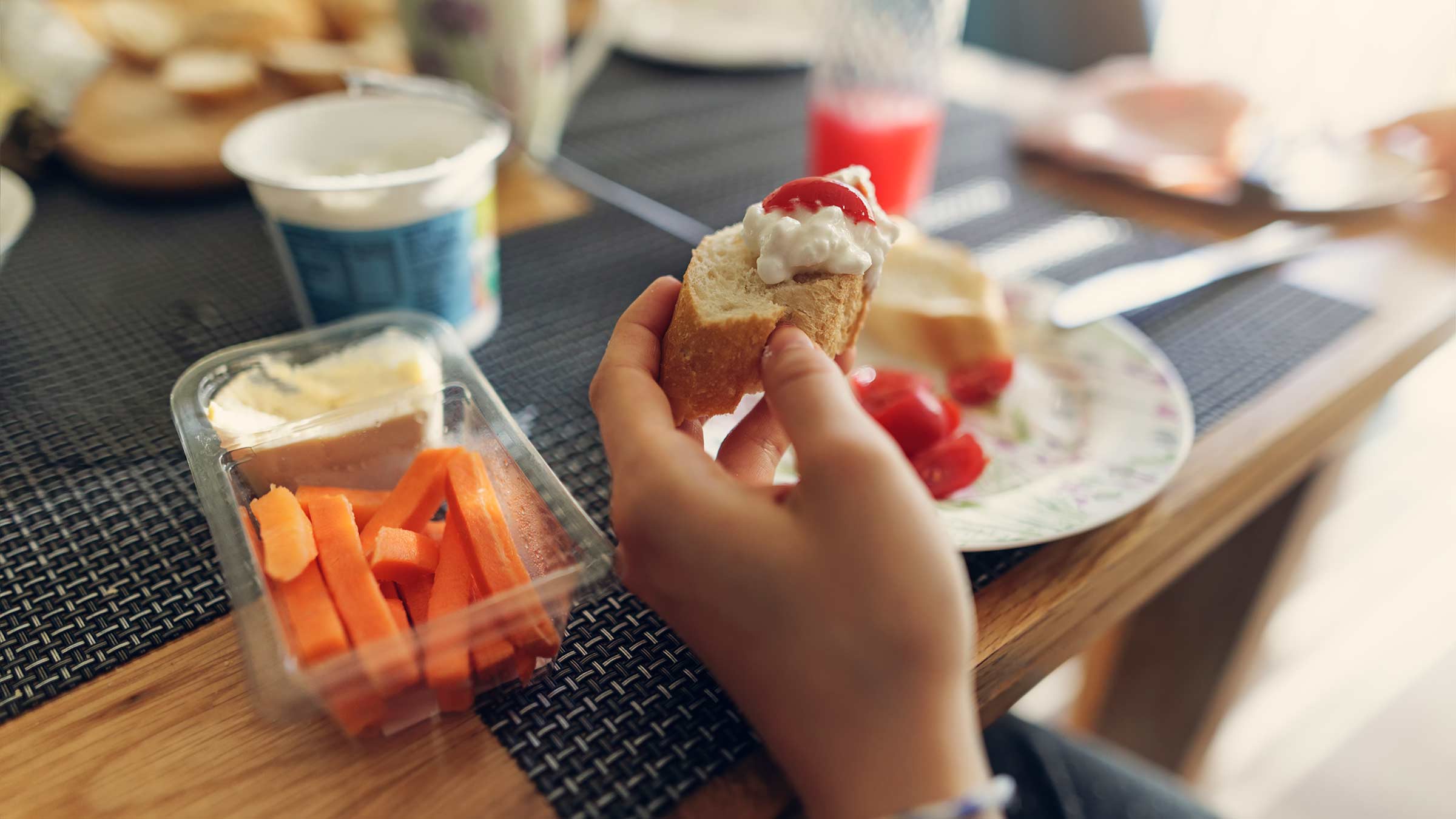 A girl eating breakfast, including cottage cheese