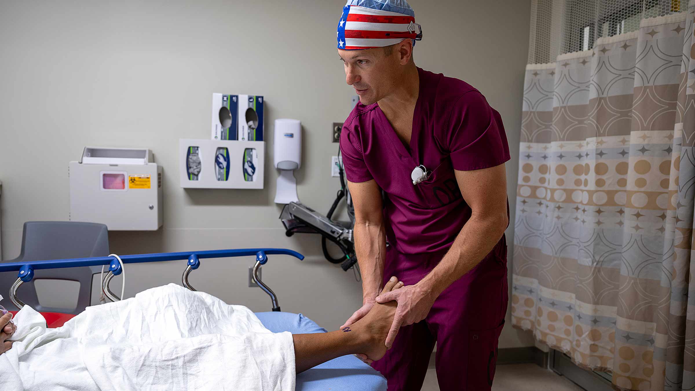 Dr. Martin examining a patient's ankle