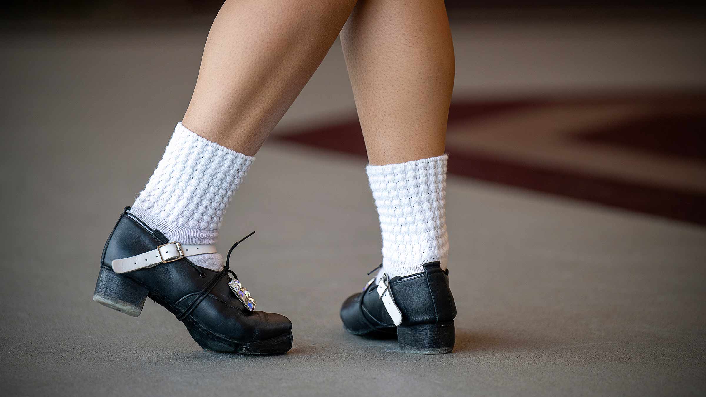 Melayna performing Irish dance steps wearing hard shoes