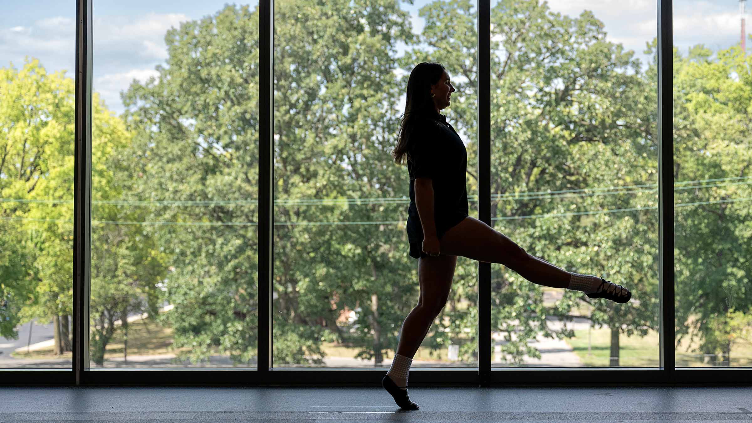 Melayna dancing in front of the window