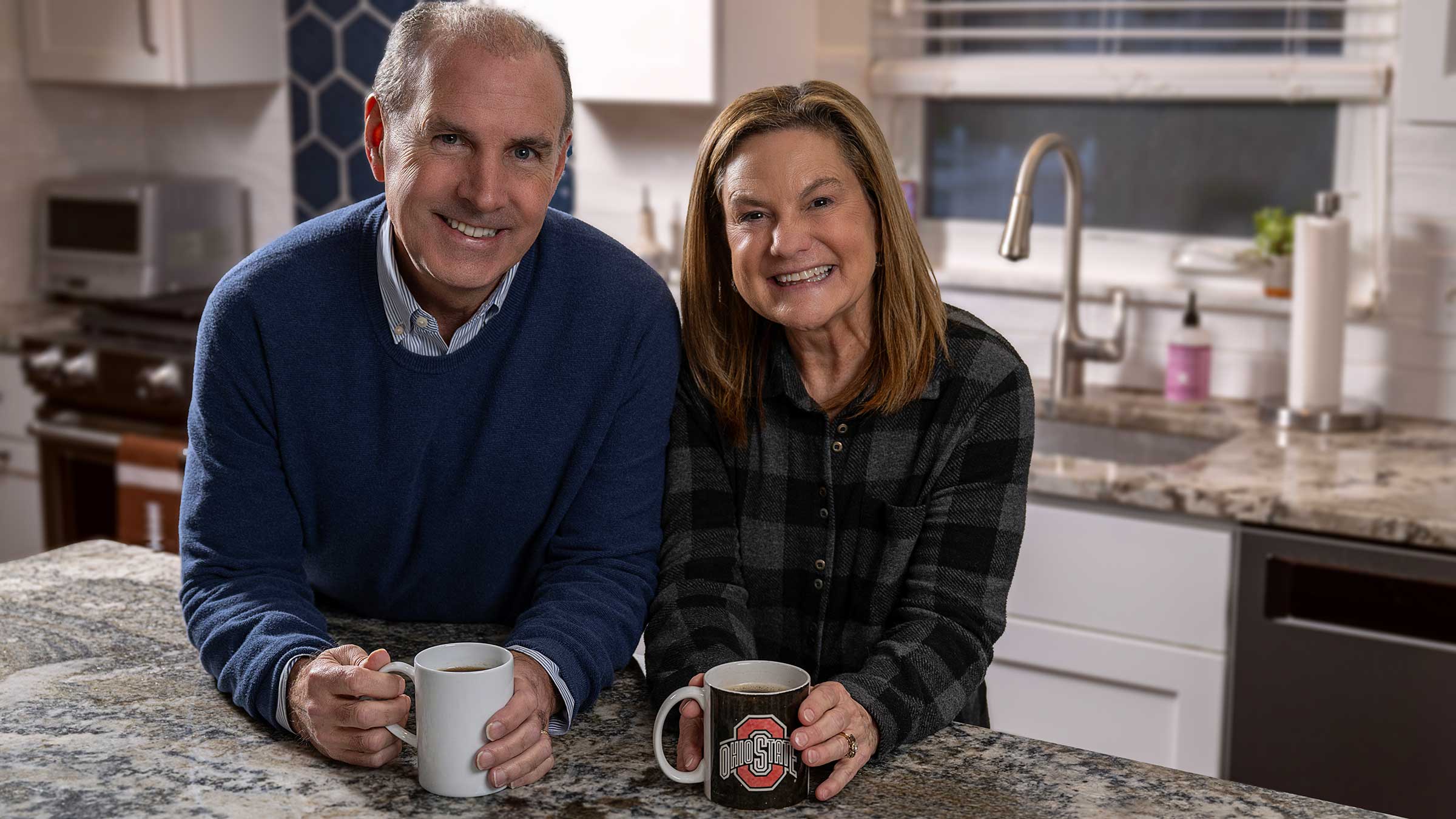 Paul Colgan with his wife in their kitchen