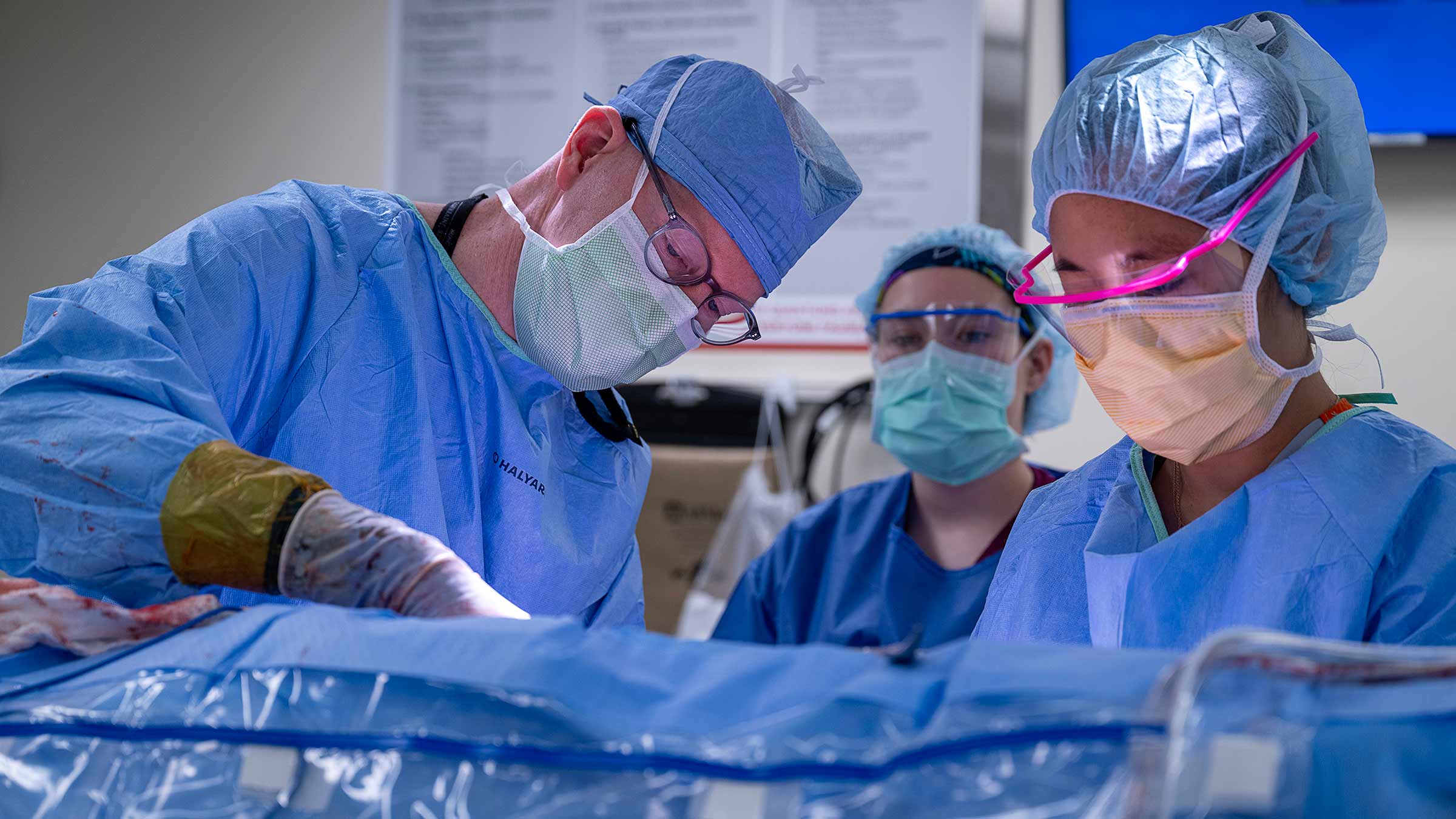Dr. Austin Schenk performing surgery with his team to extract a kidney
