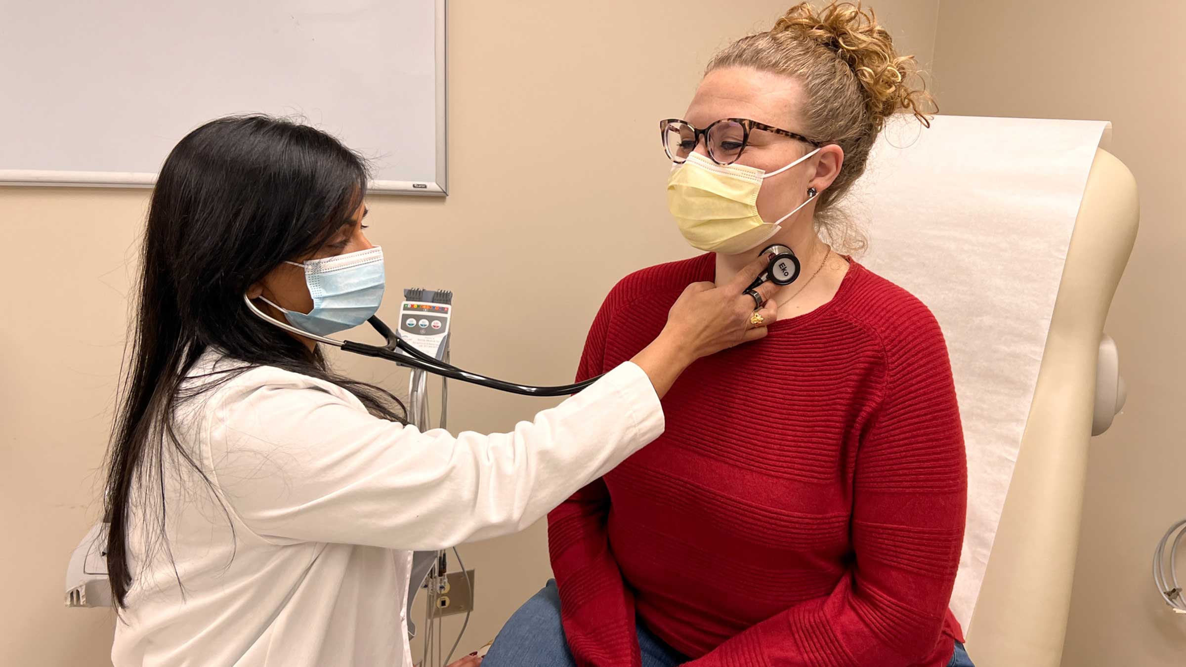 Dr. Mehta examining a female patient