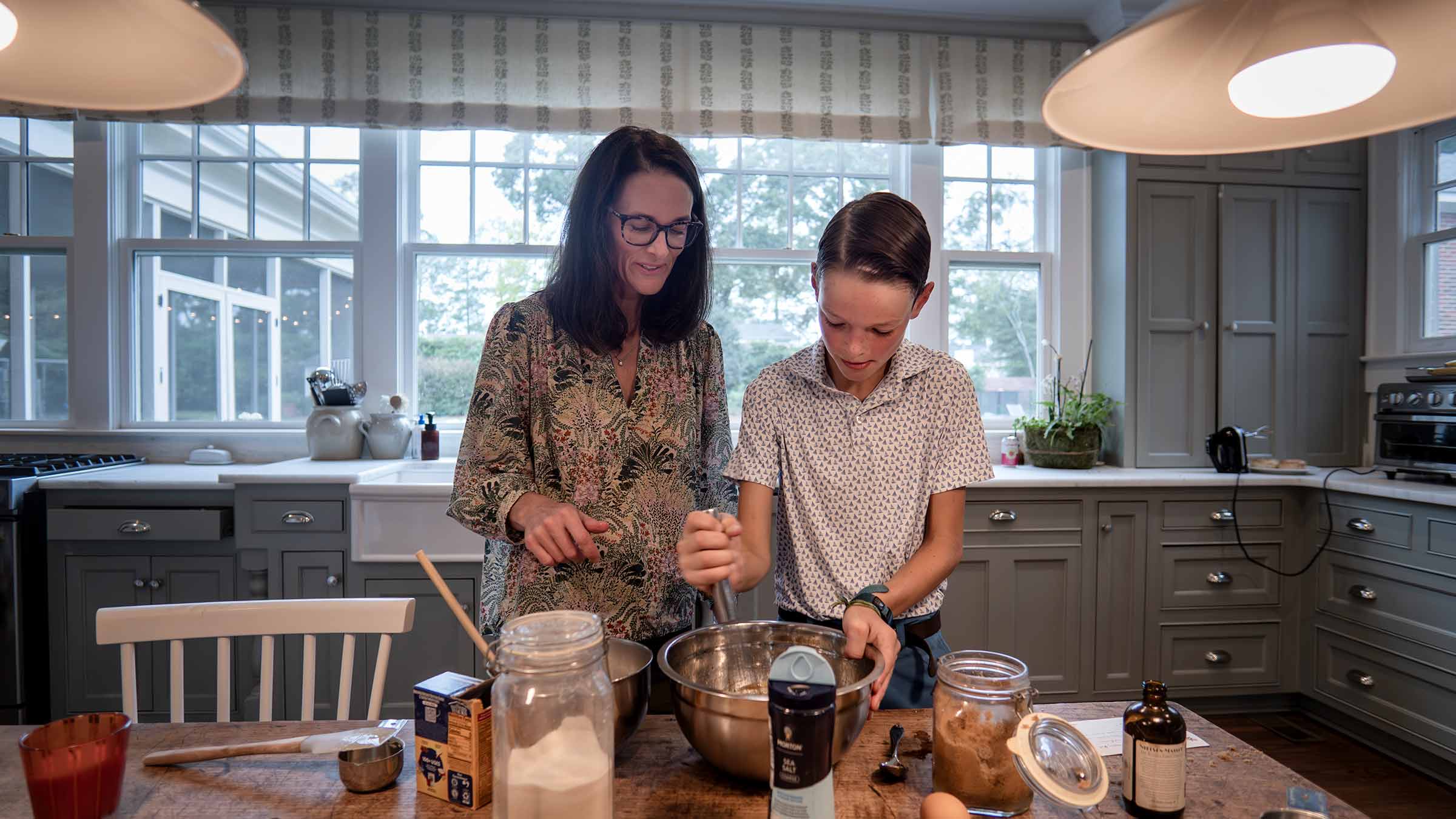 Byron cooking with his mom