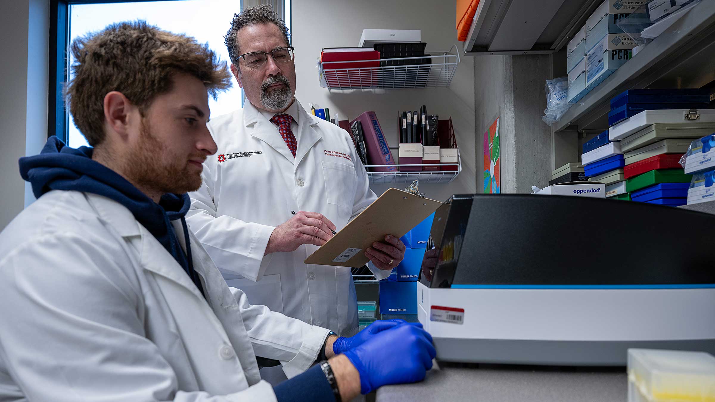 Dr. Gumina with a student in a lab